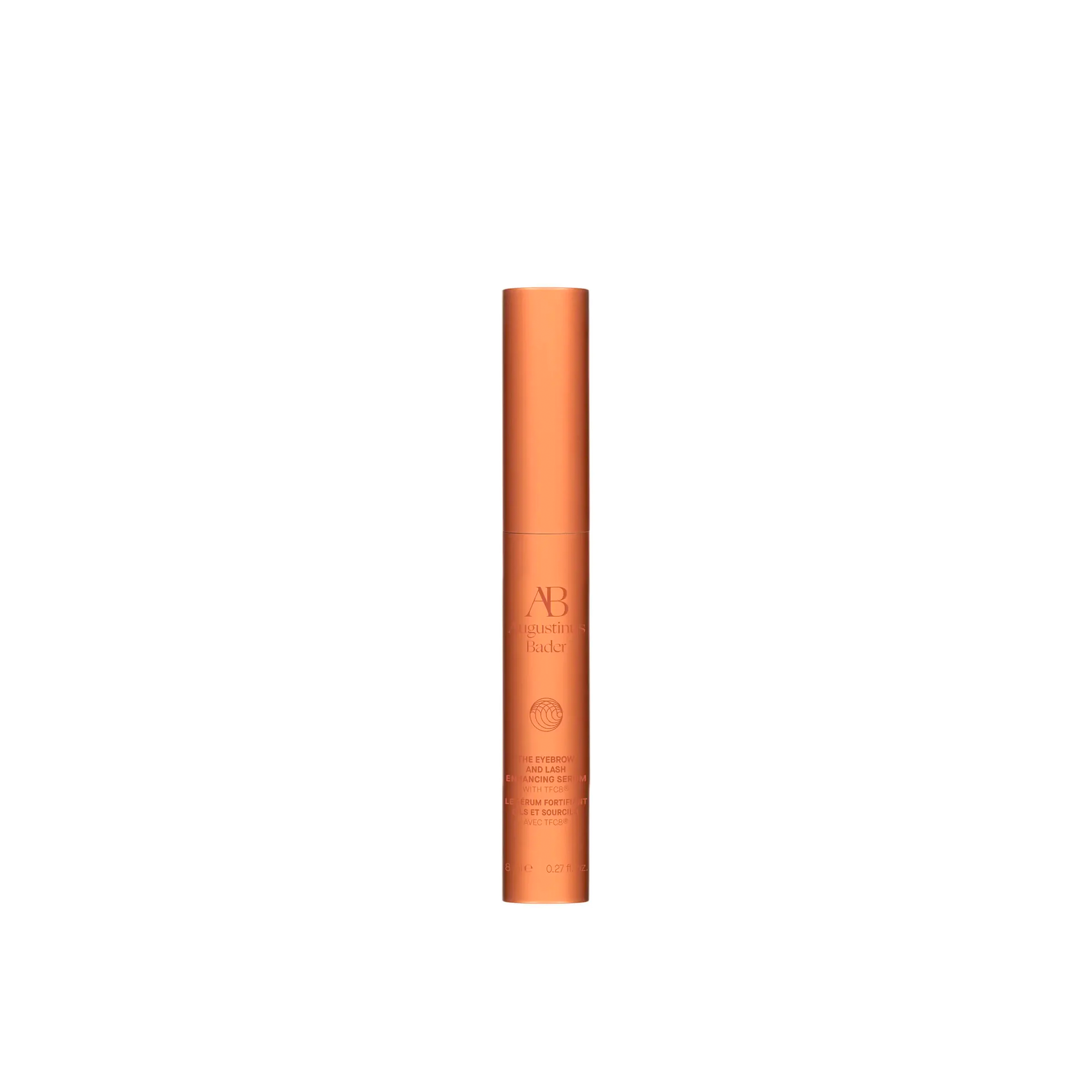 A bottle of Augustinus Bader The Eyebrow and Lash Enhancing Serum with a orange tint and brand detailing.