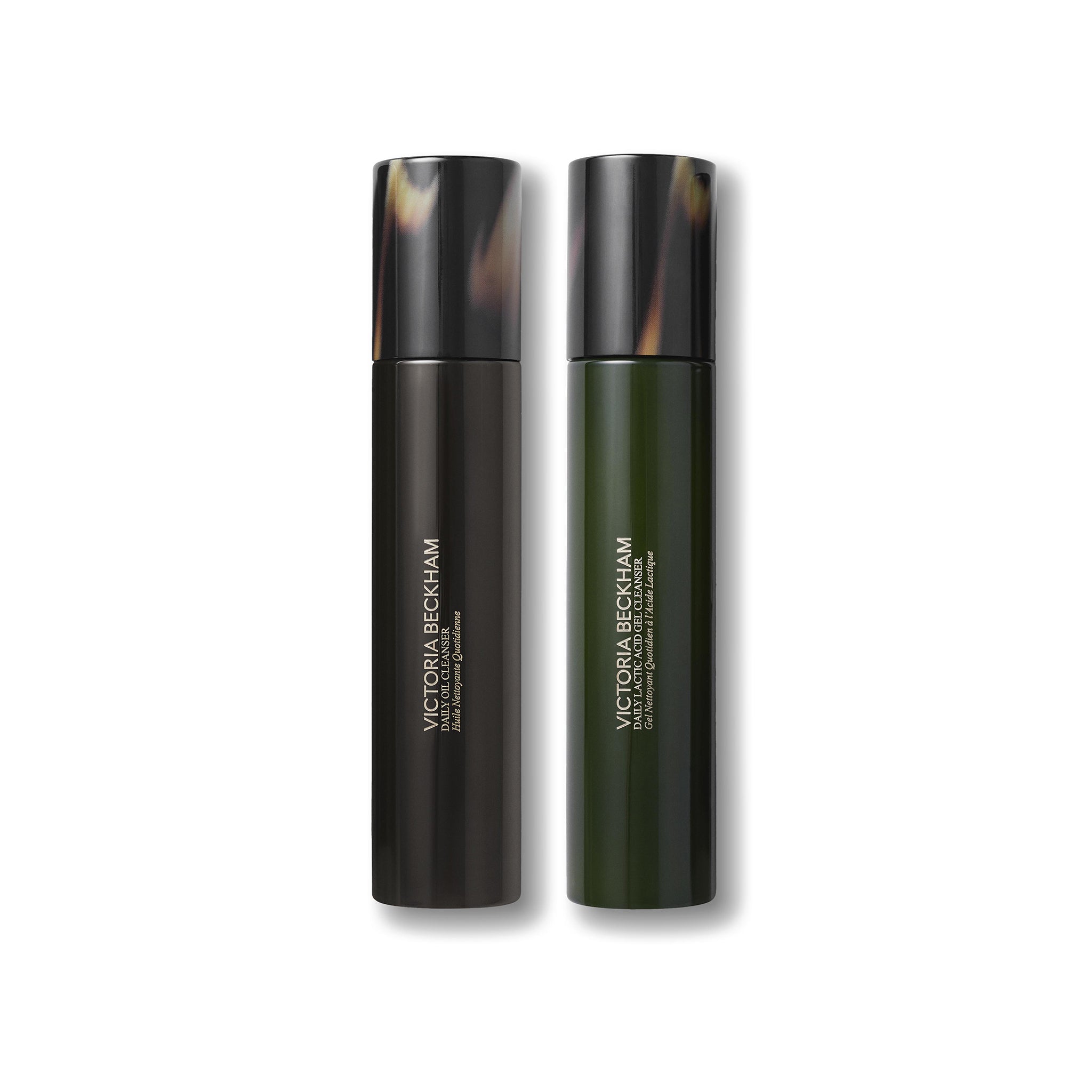 Two black and green bottles with Victoria Beckham branding on a white background