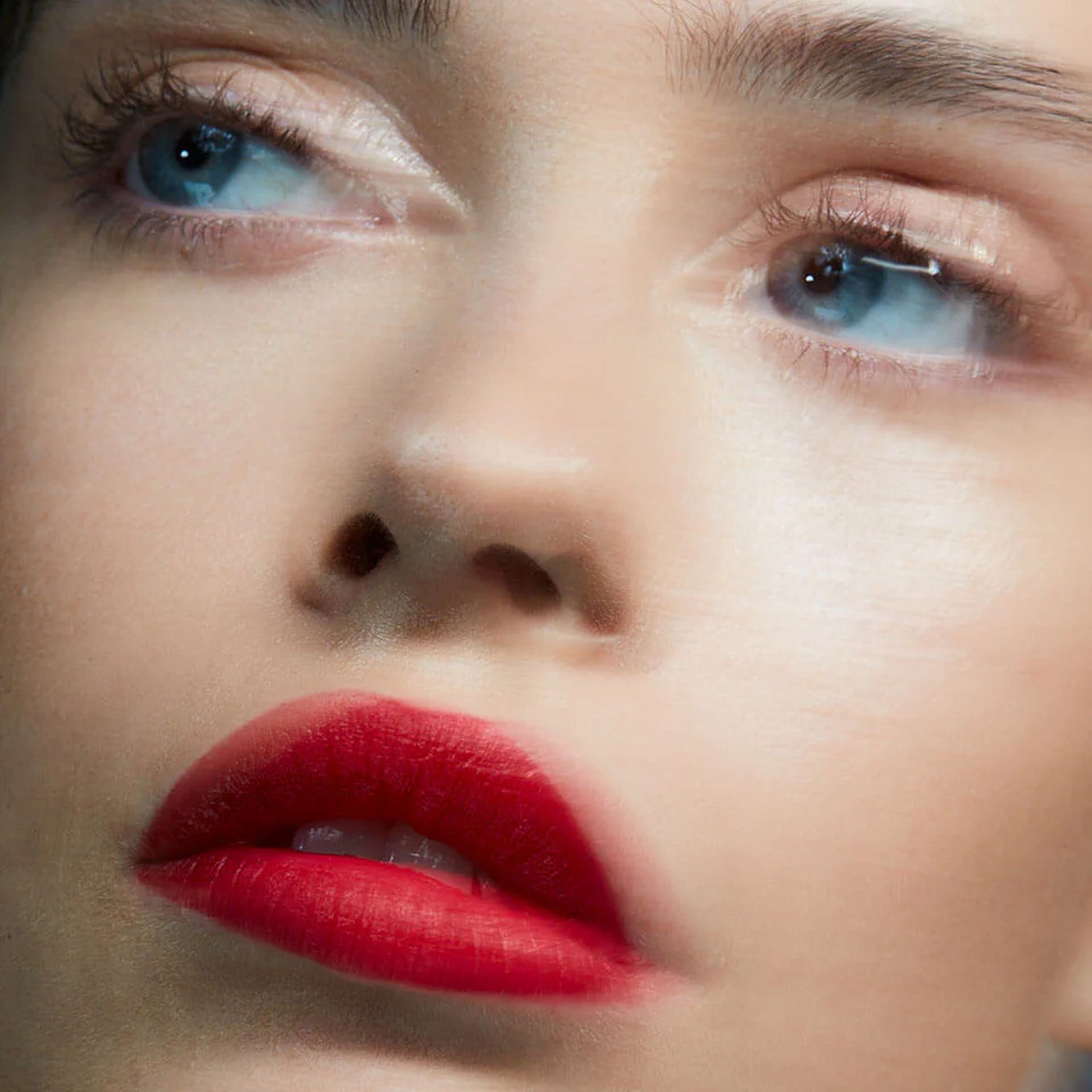 A close up image of a woman wearing Victoria Beckham Beauty Posh Lipstick in Pop