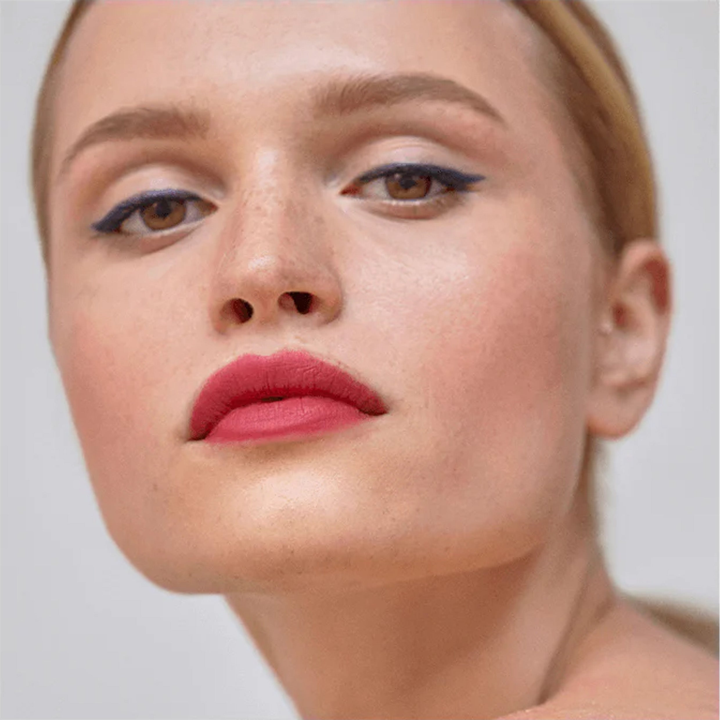 Close up lips of model wearing Victoria Beckham Beauty Bitten Lip Tint in Je'T'aime