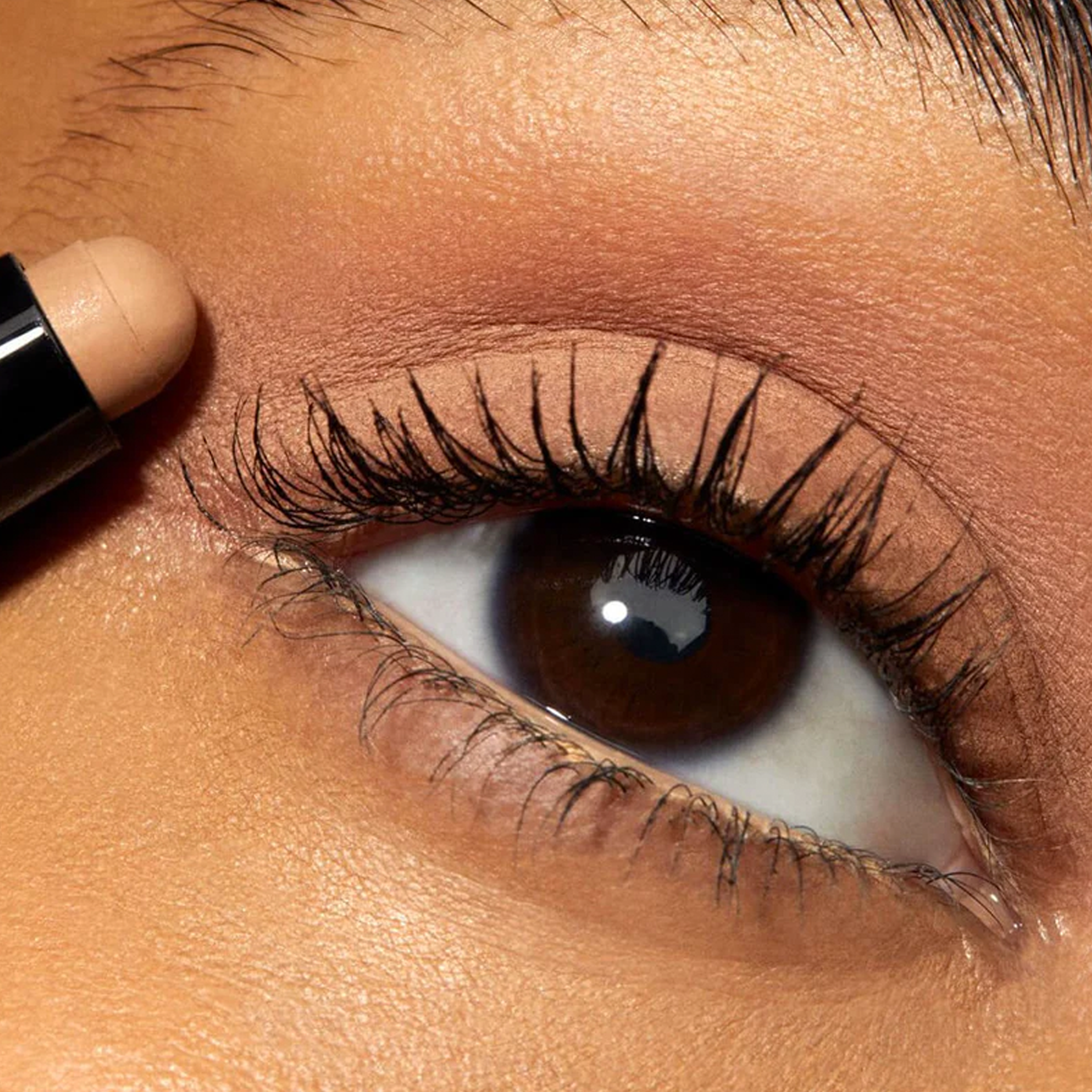 Close up of eyelid with beige eyeshadow