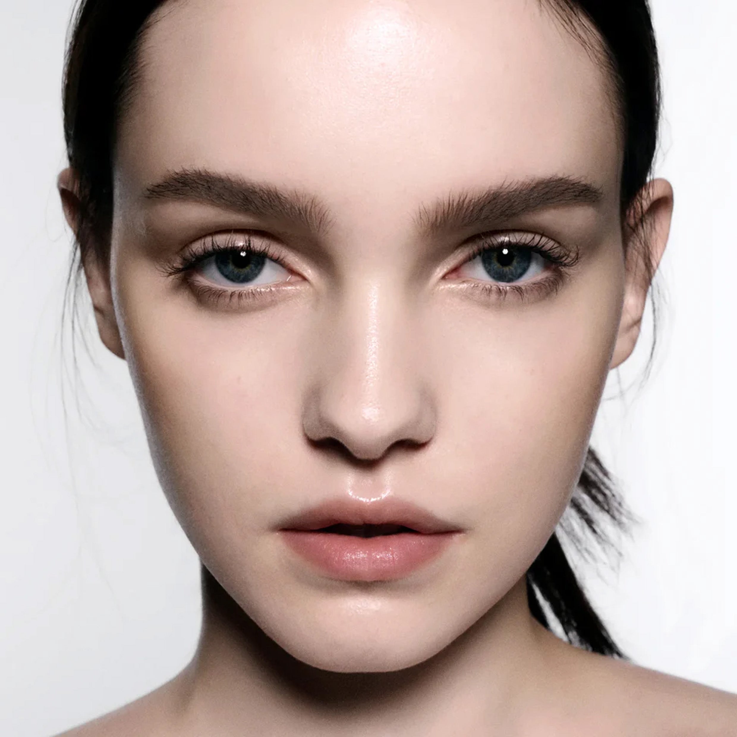 Close up of model wearing brow gel