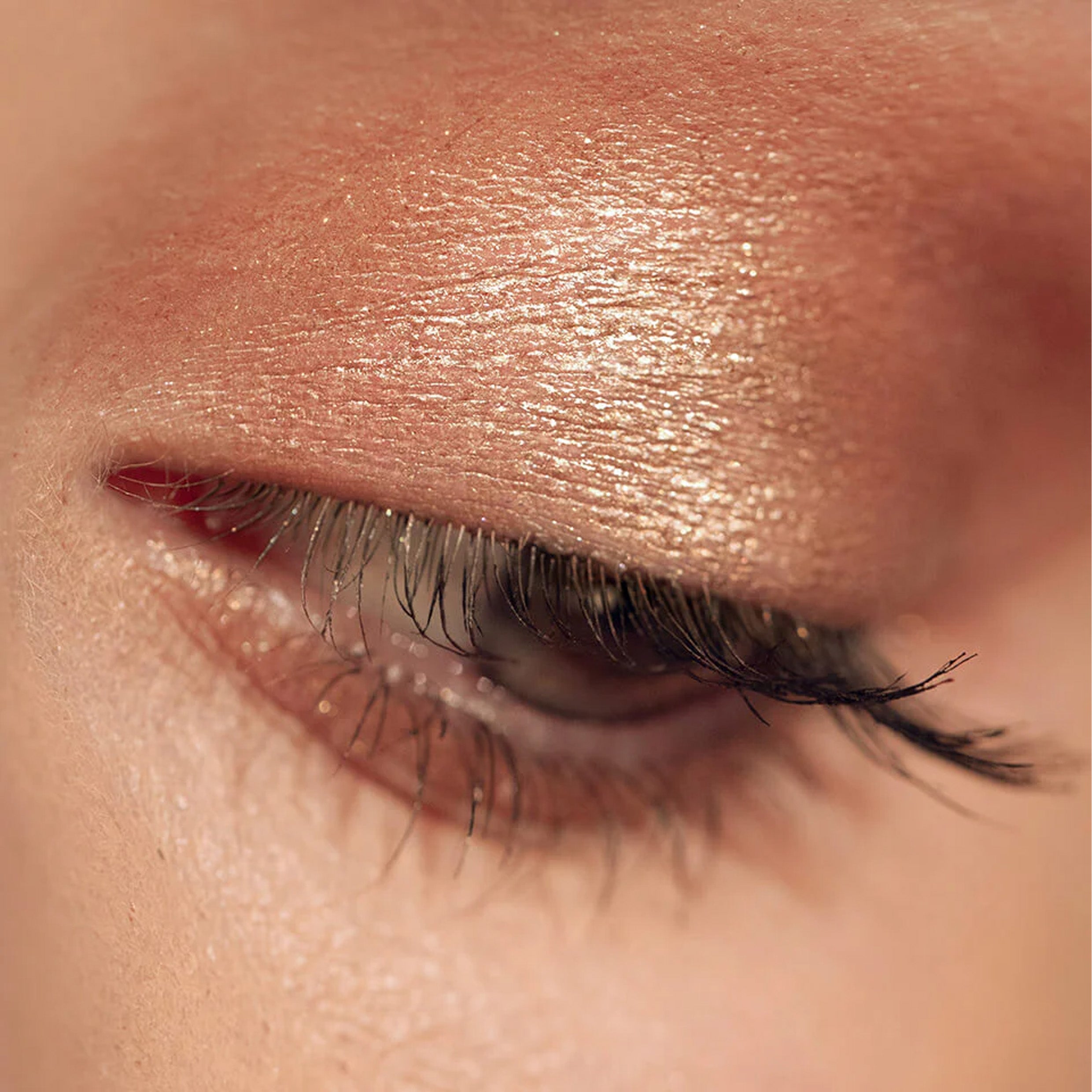 Shimmery eyeshadow on zoomed in eyelid