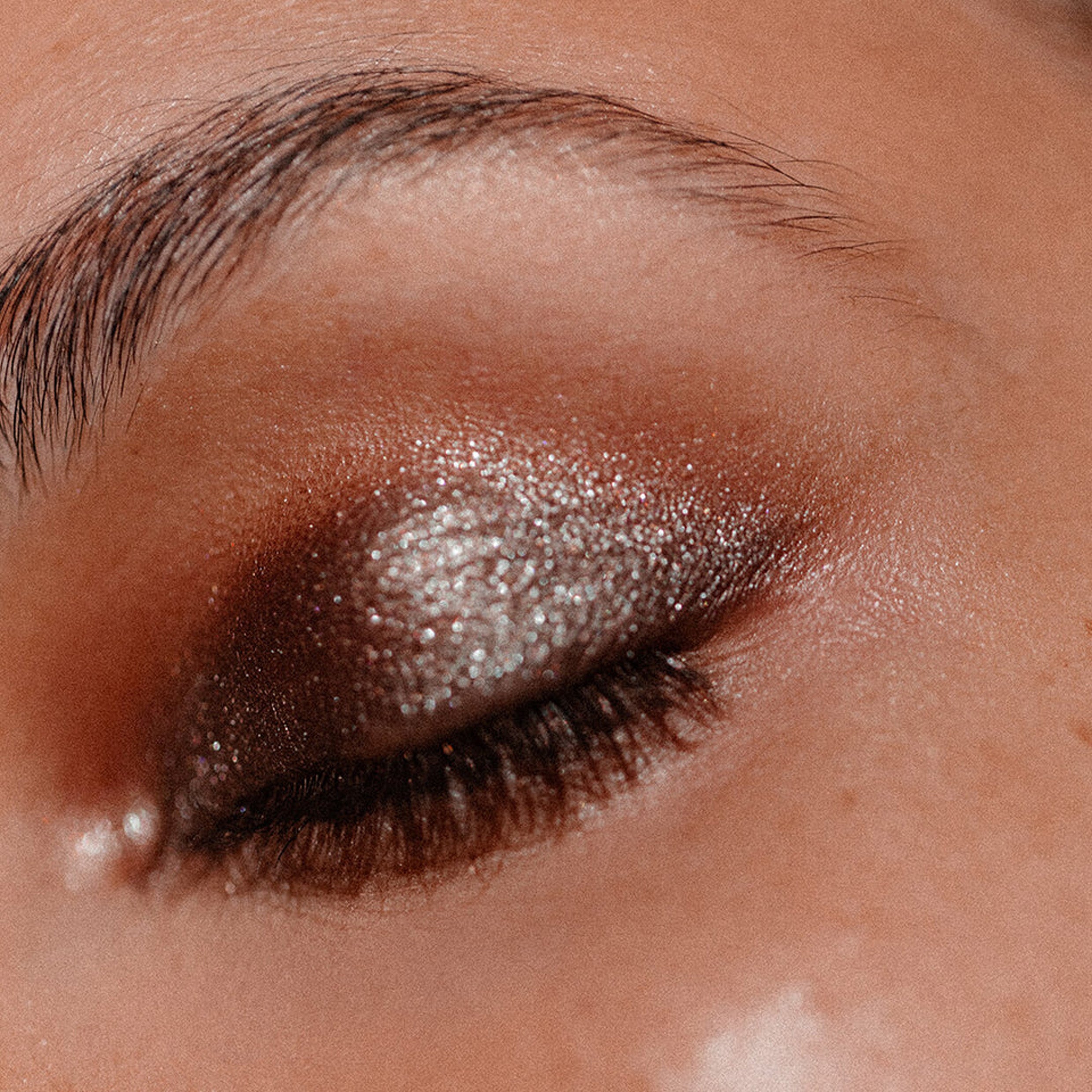 Shimmery eyeshadow on an eyelid close up