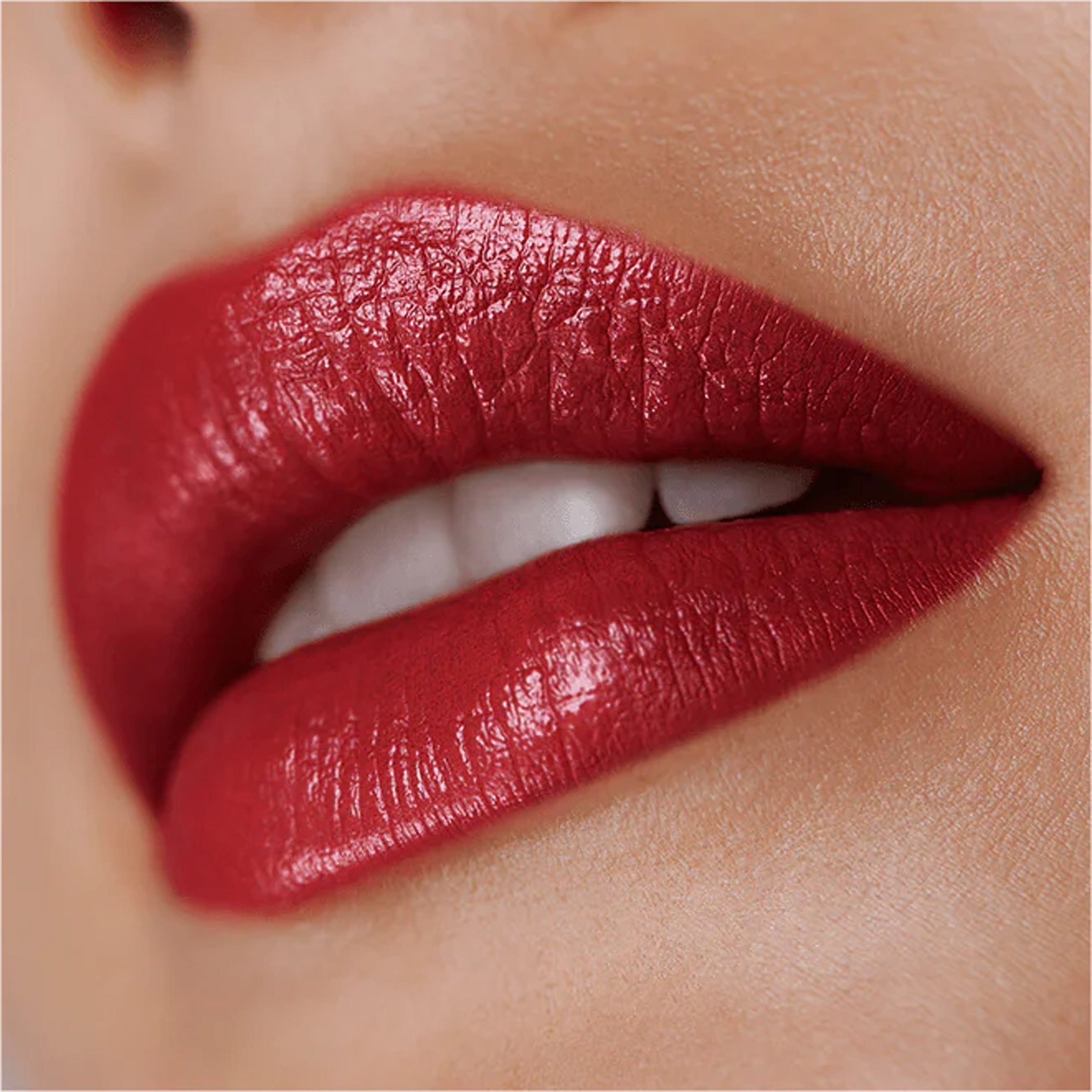 Close up image of lips with red lip products