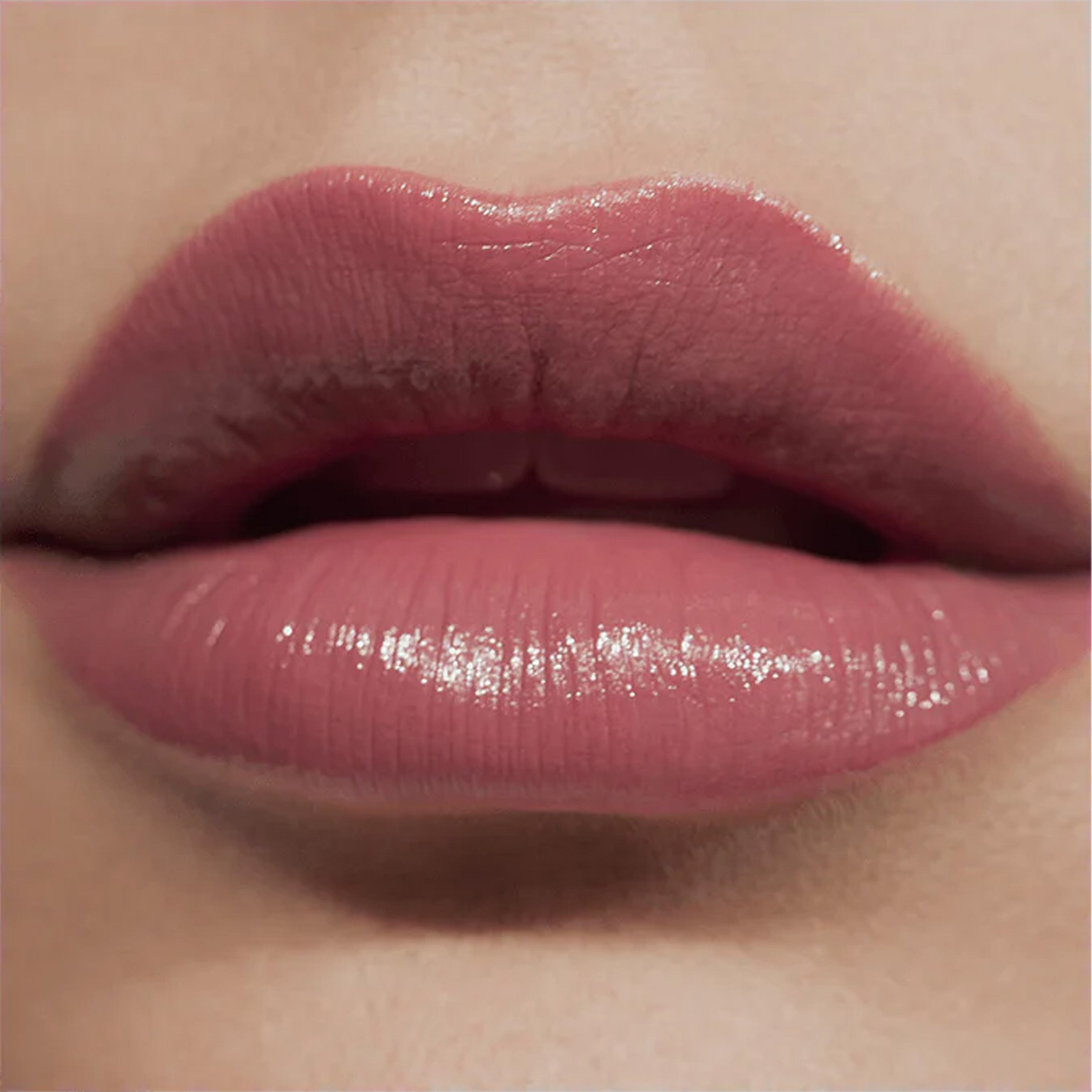 A close up image of lips wearing Victoria Beckham Beauty Posh Lipstick in Jump