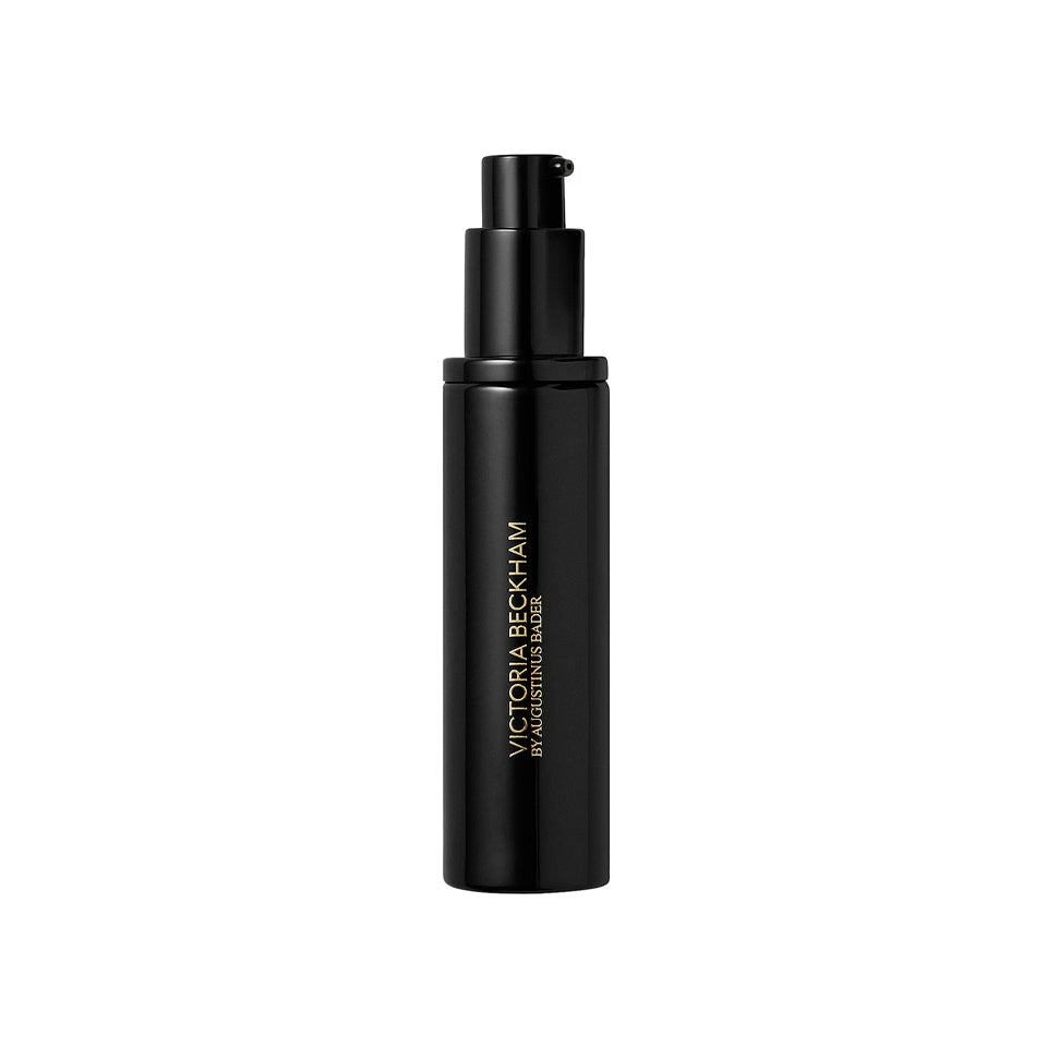 Black cosmetic bottle with 'Victoria Beckham' branding on a white background