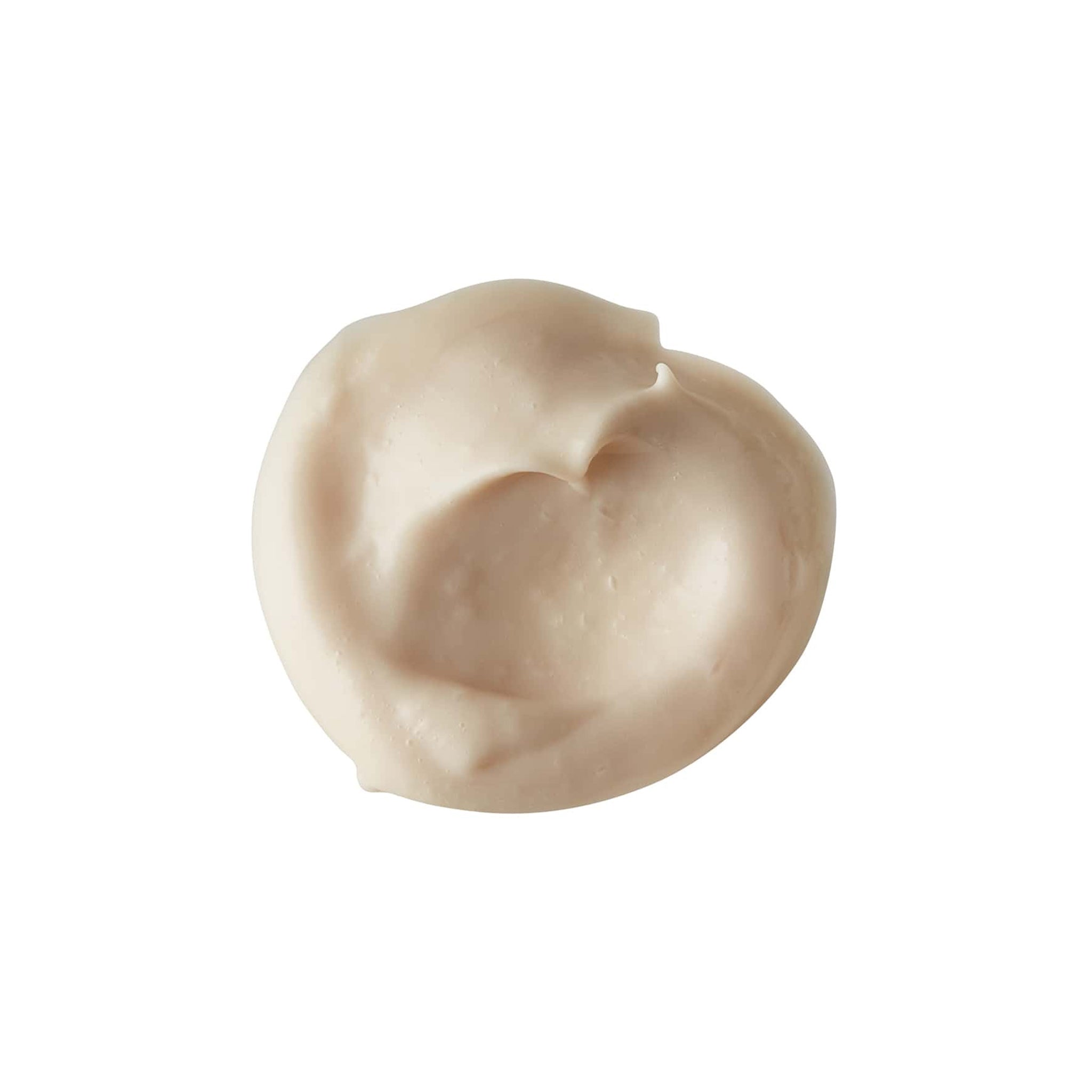 A product swatch of beige-coloured moisturiser shown on a white background