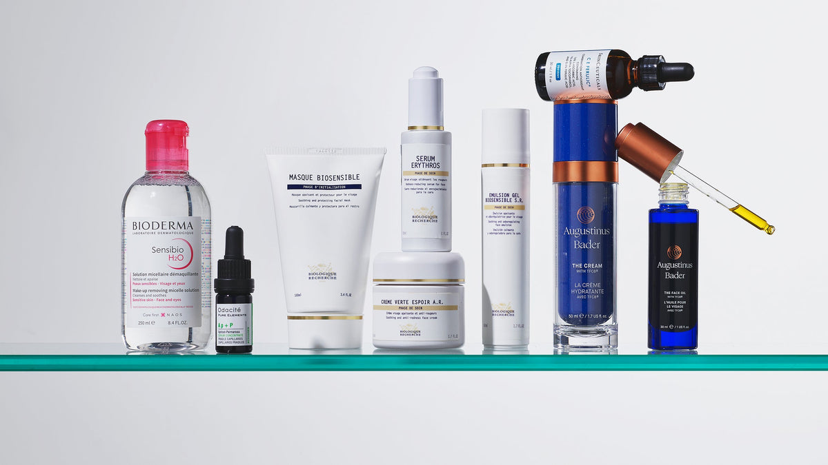 Skincare products arranged on a glass shelf from the Rosacea & Redness photography archive