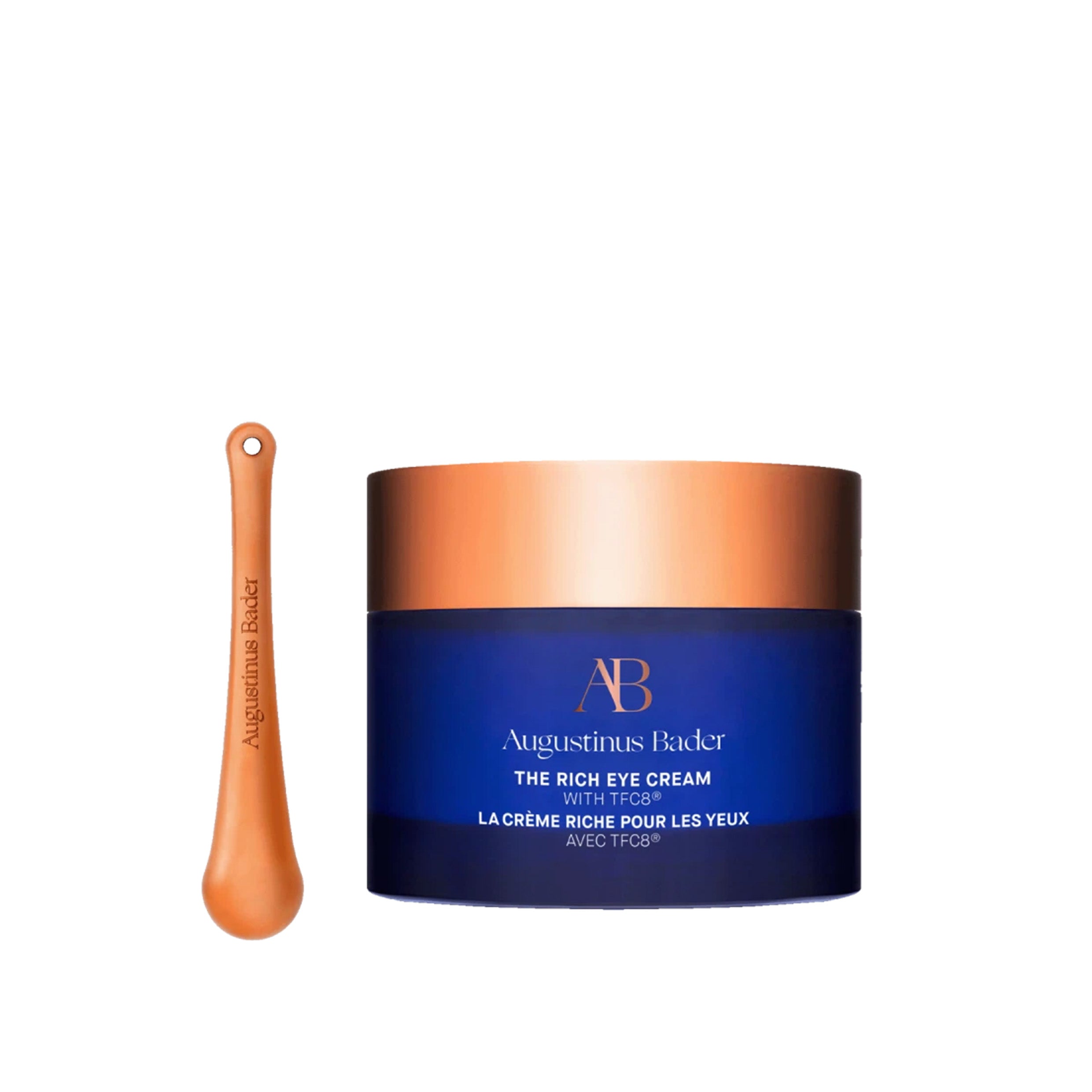 A jar of eye cream with the spoon applicator shown on the side.