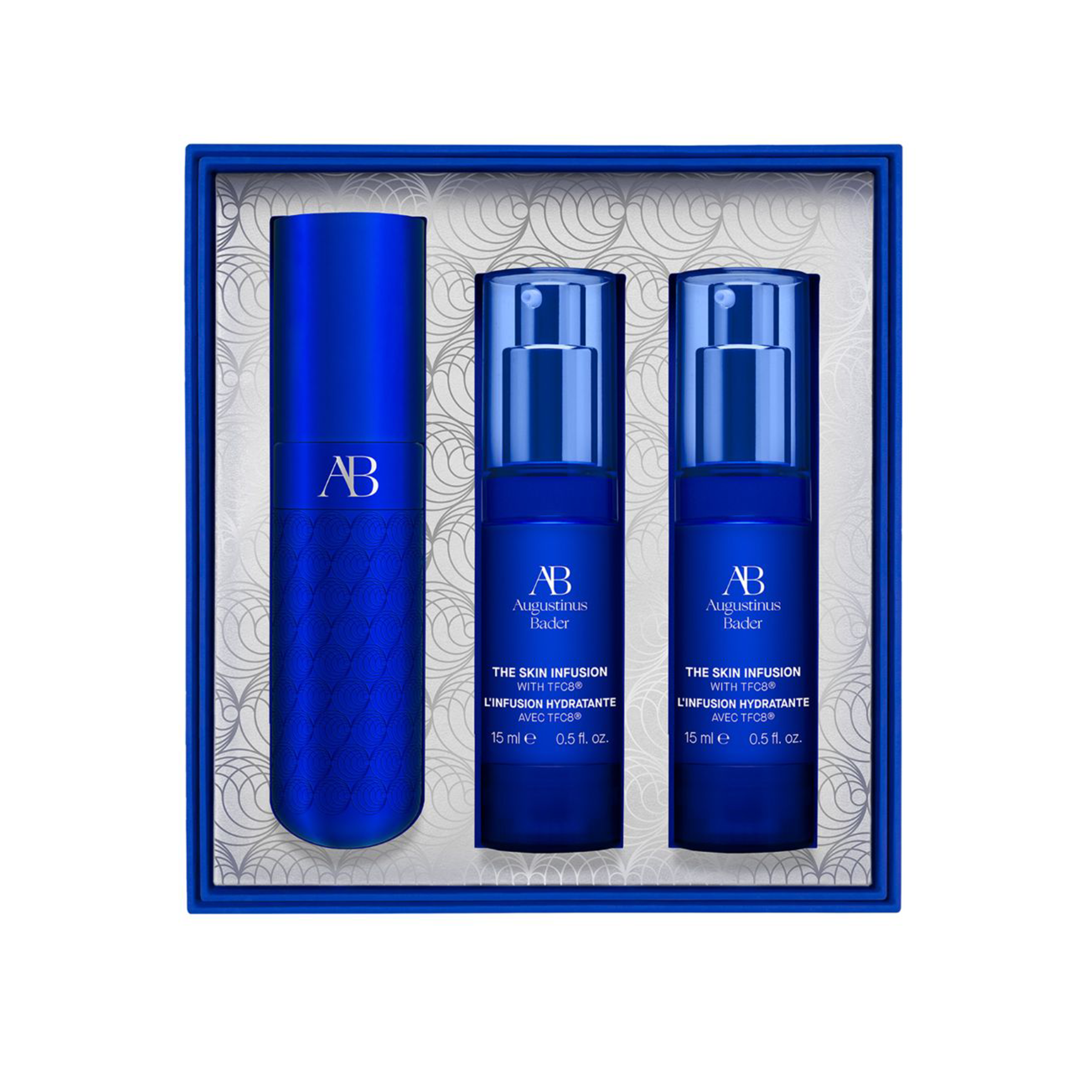A product set by Augustinus Bader titled 'The Skin Infusion', consisting of three blue pump bottles and a cream container, presented in a box with a patterned design.
