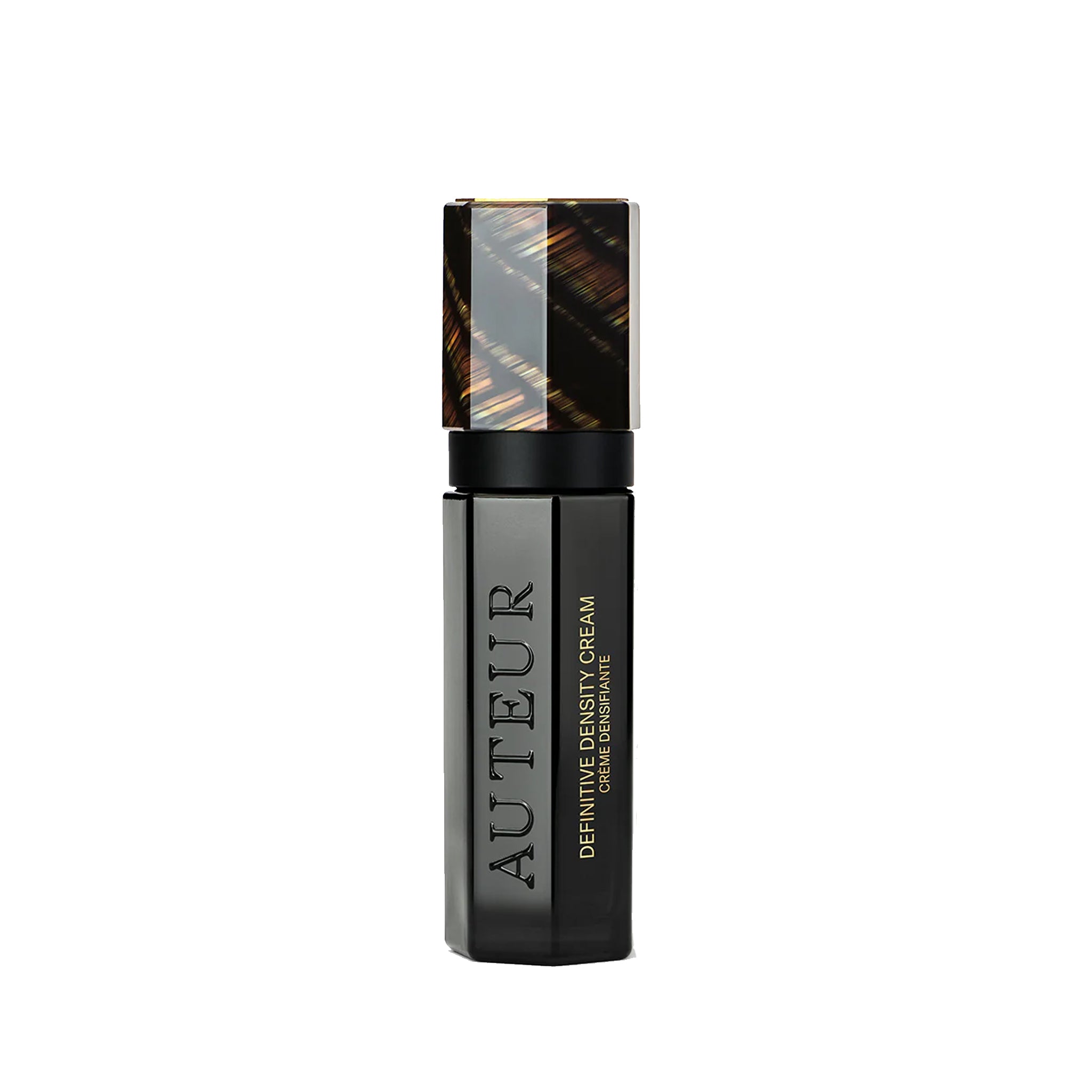 Black cosmetic bottle with gold accents on a white background