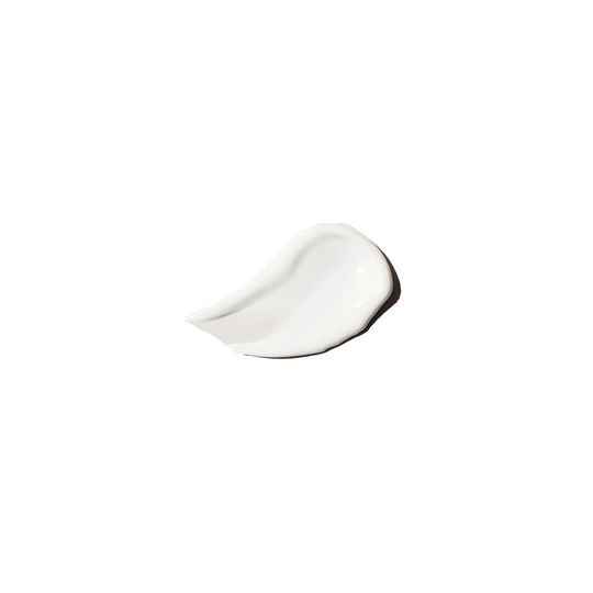 Texture of lip treatment, a white creamy serum