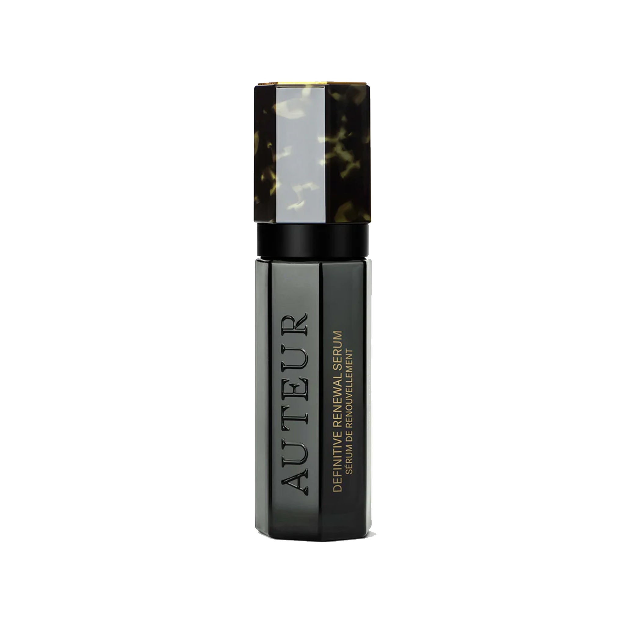 A bottle of Auteur Definitive Renewal Serum with a dark cap and a label featuring the brand name and product title.