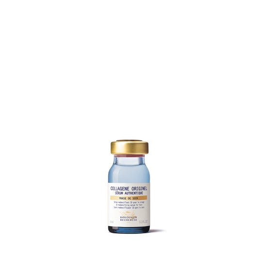 Vial with a gold cap on a white background