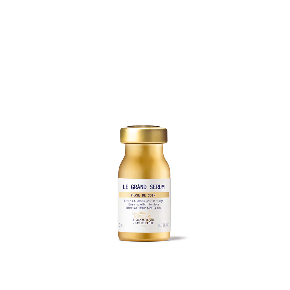 A golden glass vial of Biologique Recherche Le Grand Serum with a white label.