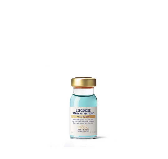 A glass vial of Biologique Recherche Serum Liposmose, containing a blue liquid