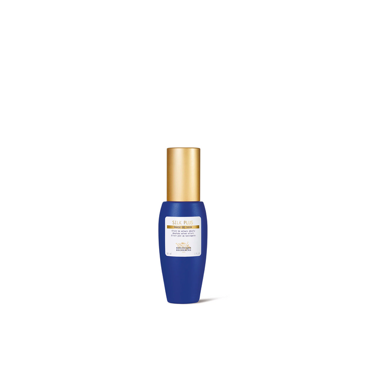 A blue bottle with a gold cap labeled 'Biologique Recherche Silk Plus' against a white background.