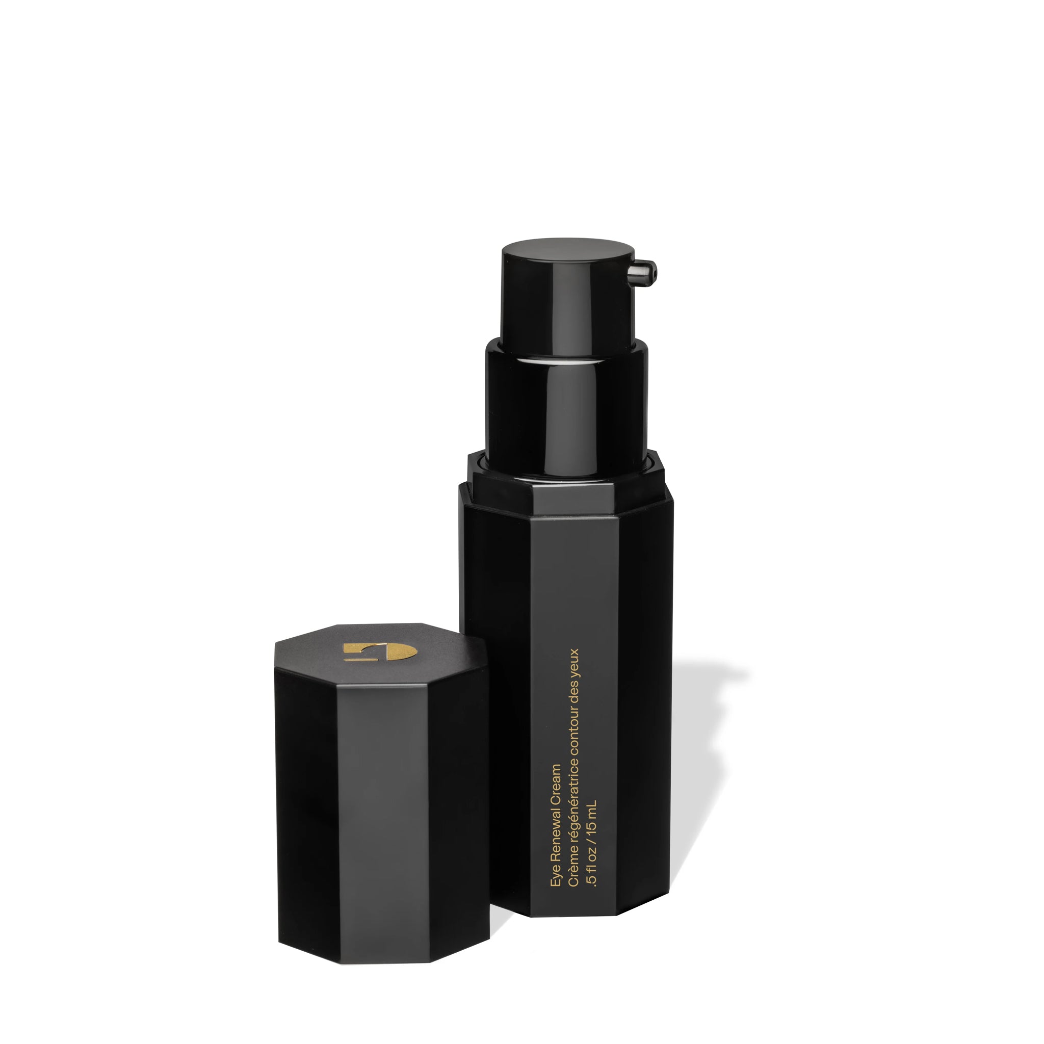 Black cosmetic bottle and cap on a white background