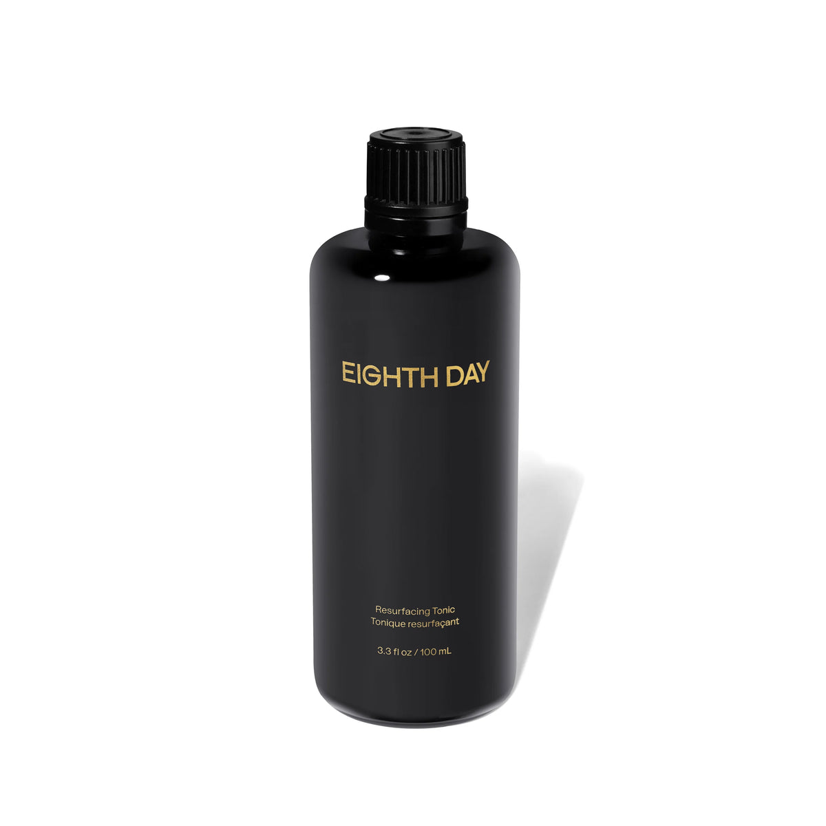 Black bottle of Eighth Day product on a white background