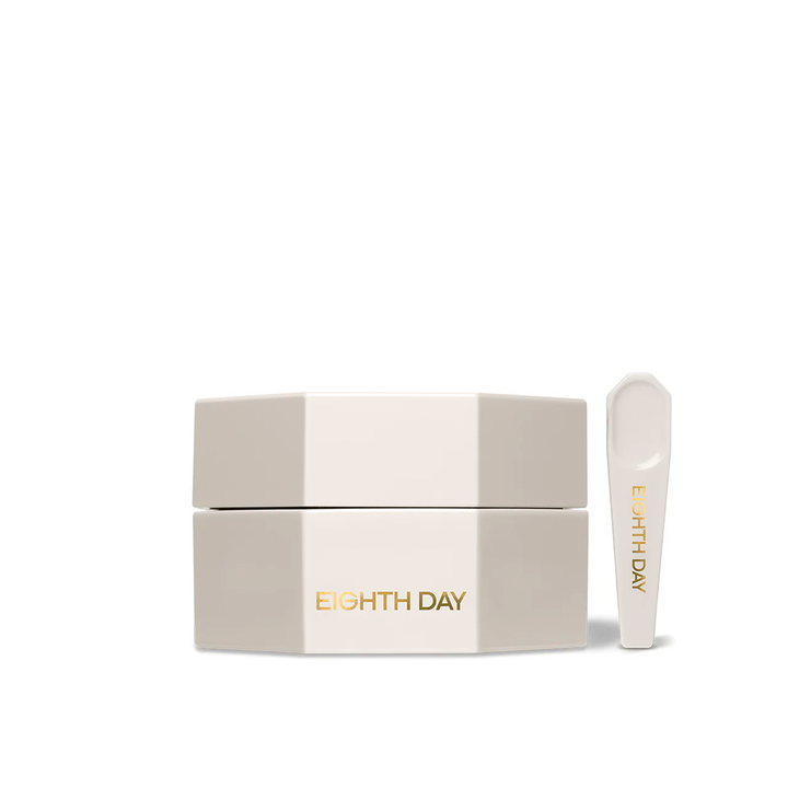 A white jar with a lid and a spoon applicator both labeled with 'EIGHTH DAY' against a neutral background.