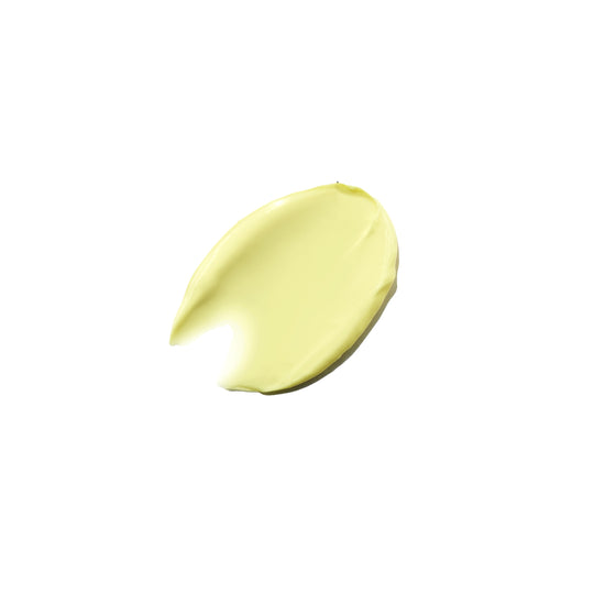 A product swatch of a night cream, showing a yellow colour