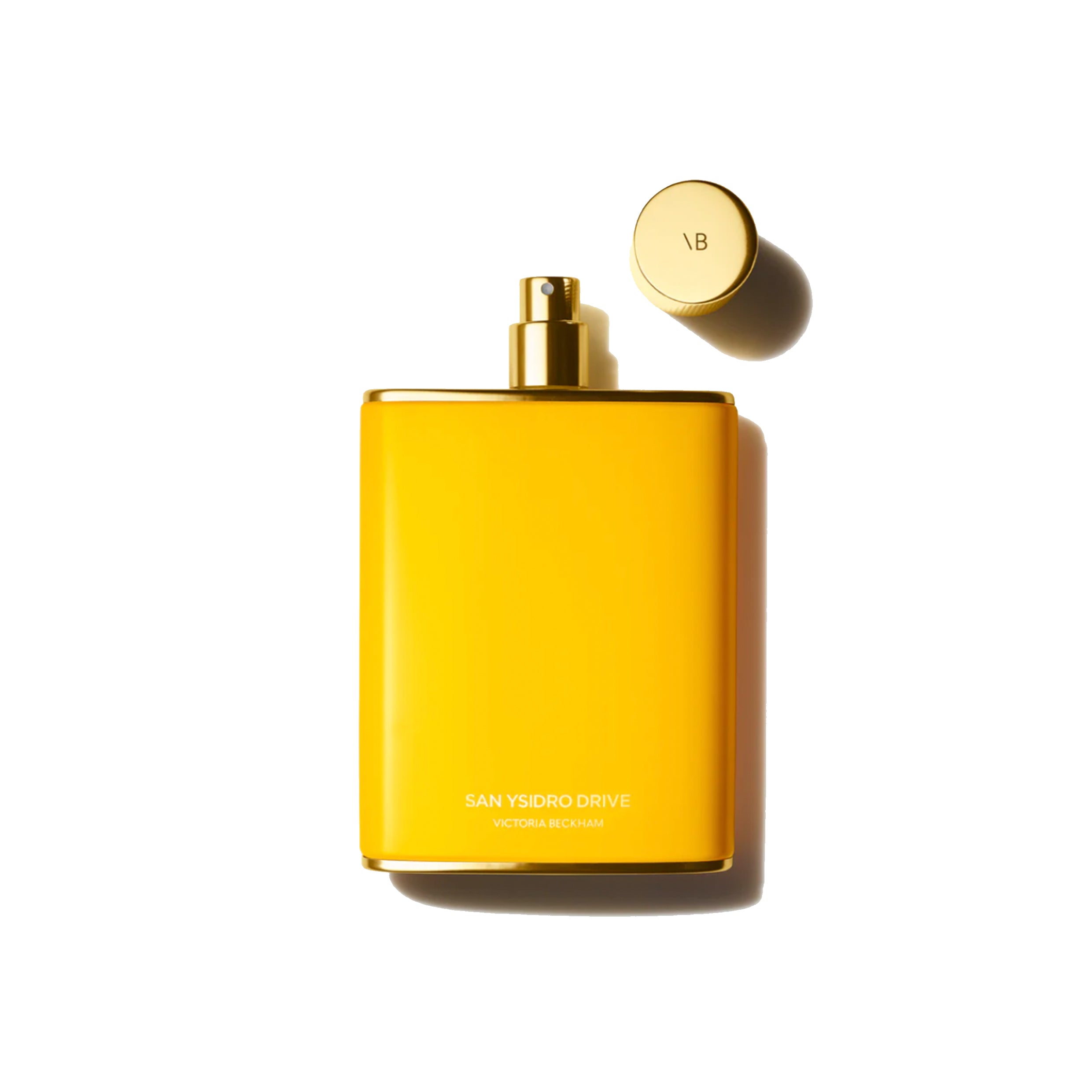 A yellow bottle of Victoria Beckham Beauty San Ysidro Drive Eau de Parfum with the cap removed, displayed against a white background.