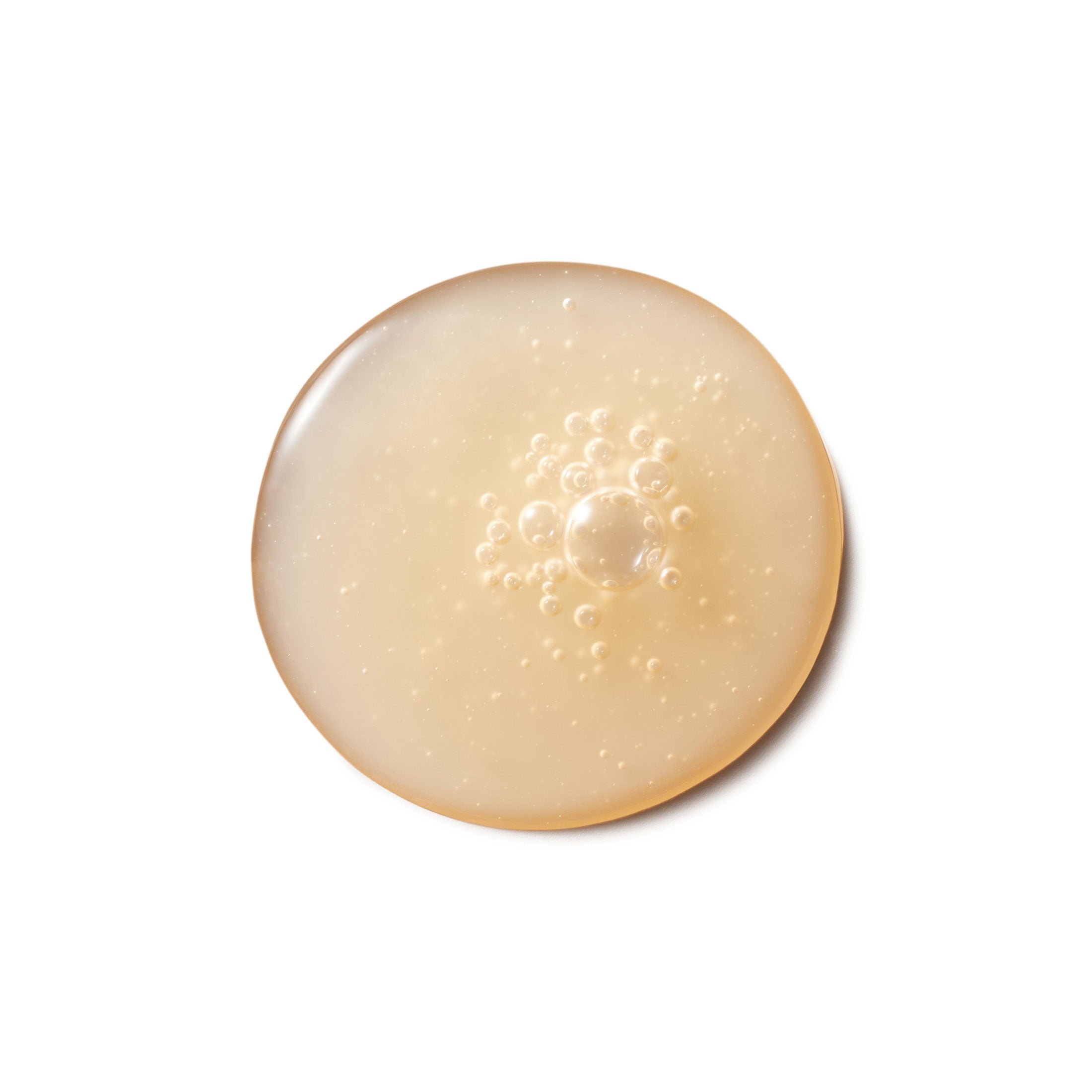 Beige gel with bubbles on a white background
