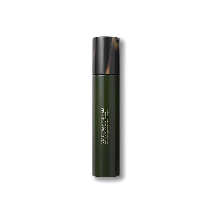 Green bottle with tortoiseshell cap on a white background