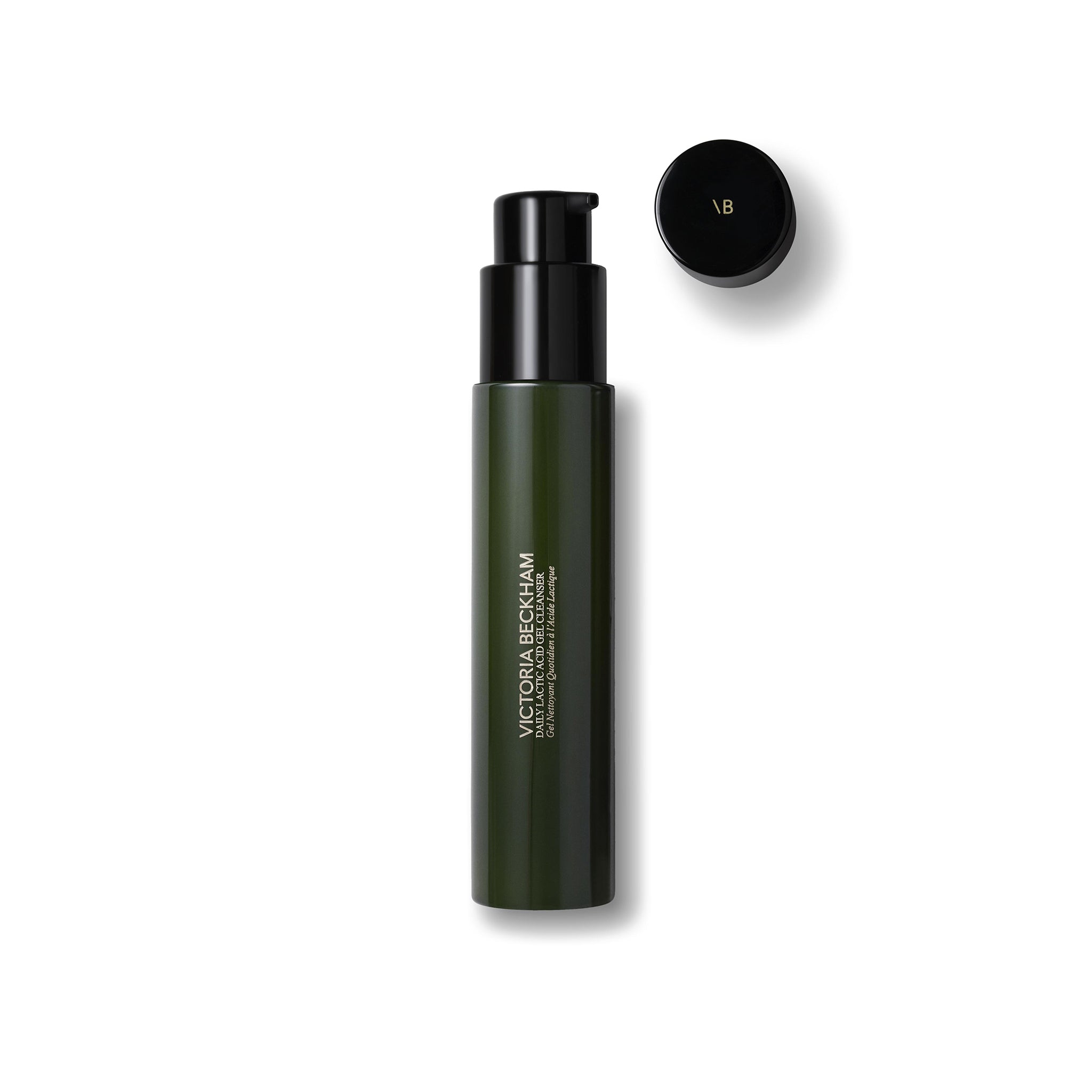 Green cosmetic bottle with black cap on a white background