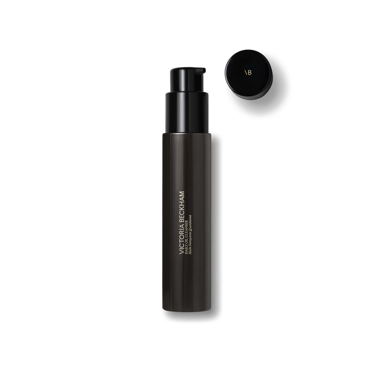 Black cosmetic bottle with cap on a white background