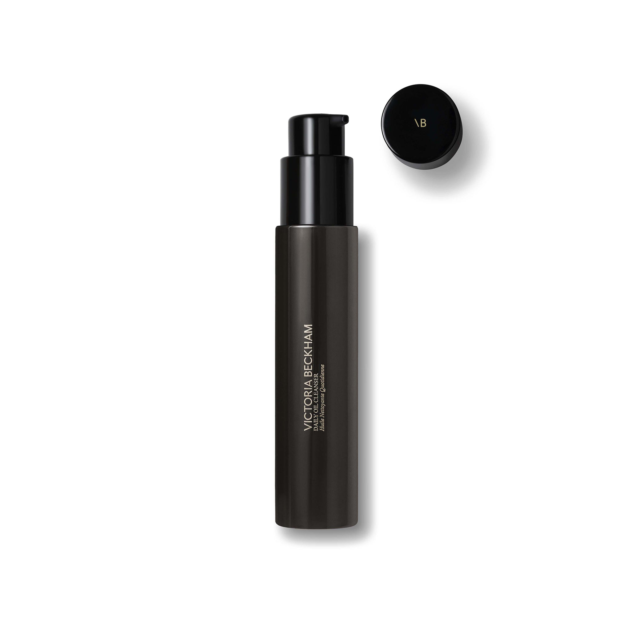 Black cosmetic bottle with cap on a white background