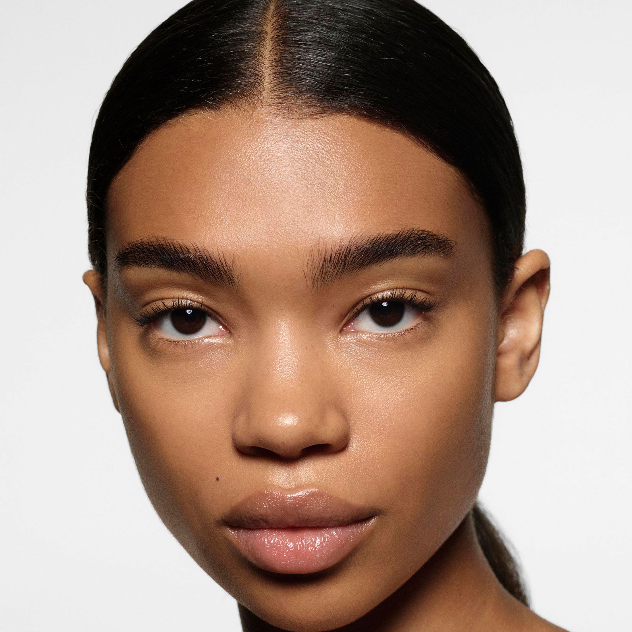 Close-up of a person with a neutral background