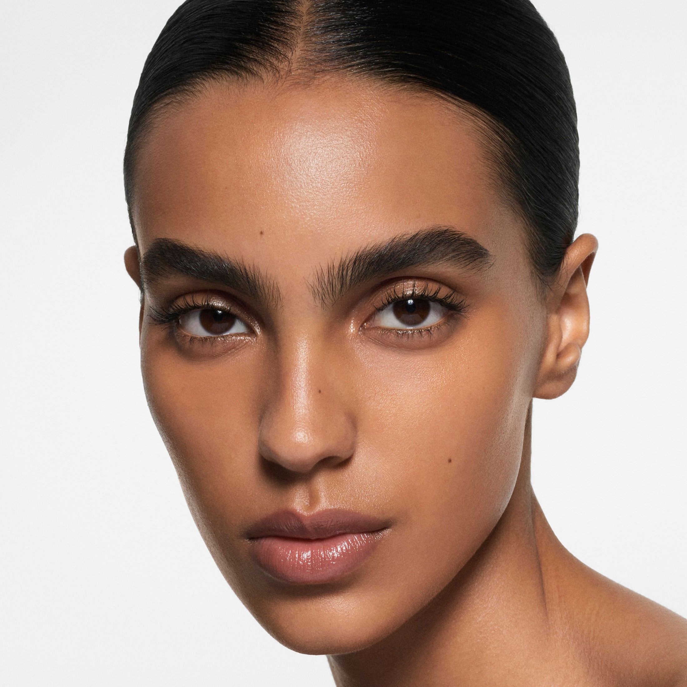 Close-up of a person with a neutral background
