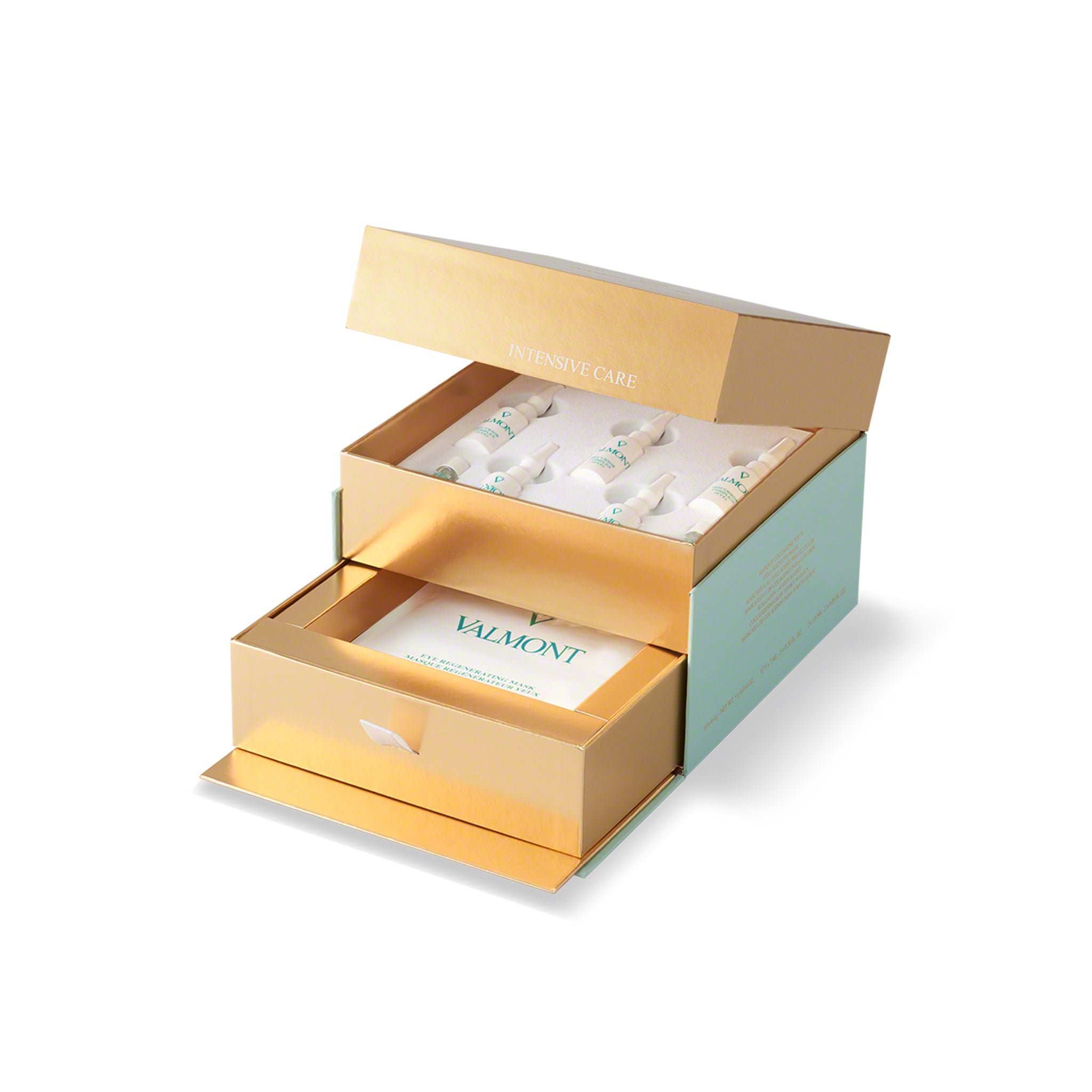 Open gold and green cosmetic box with Valmont products on a white background