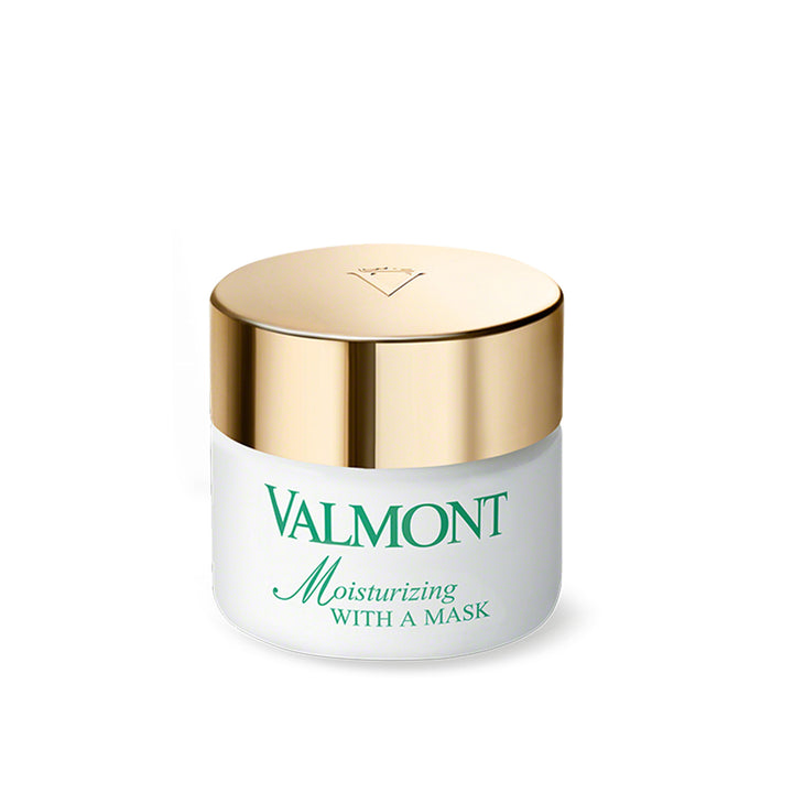 A jar of Valmont Moisturizing With A Mask, featuring a white body with a gold-colored lid.