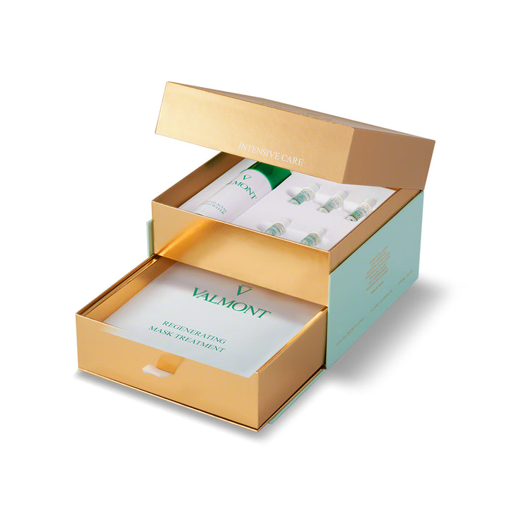 Valmont skincare products in an open gold and green box on a white background