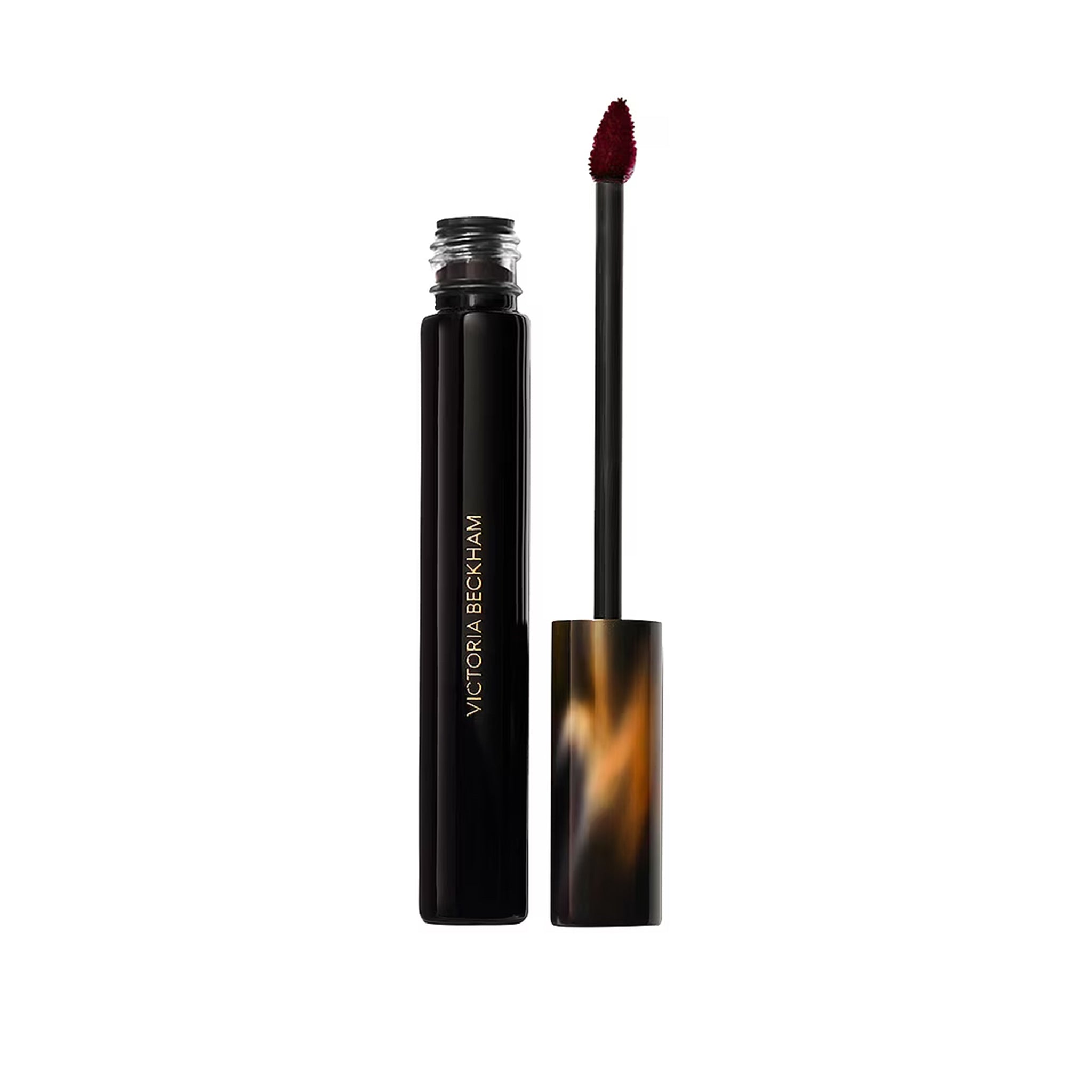 Victoria Beckham lip gloss with applicator on a white background