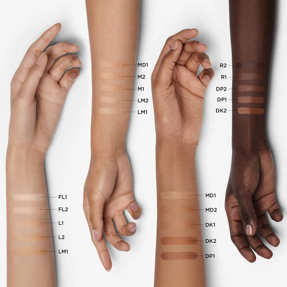 Hands with swatches of makeup on different skin tones
