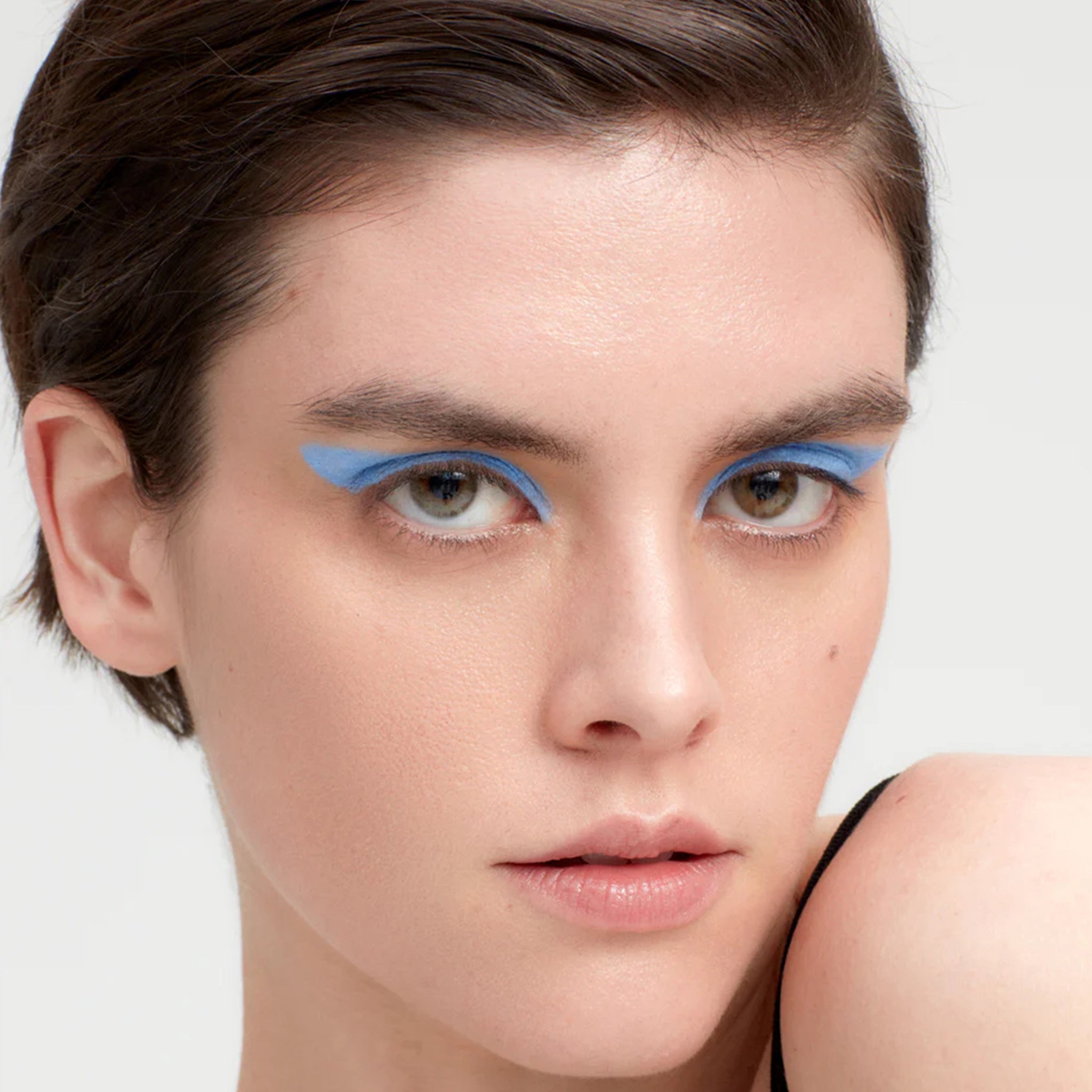 Model wearing blue eyeshadow
