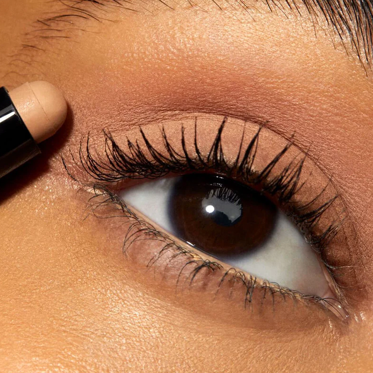 Close up of eyelid with beige eyeshadow