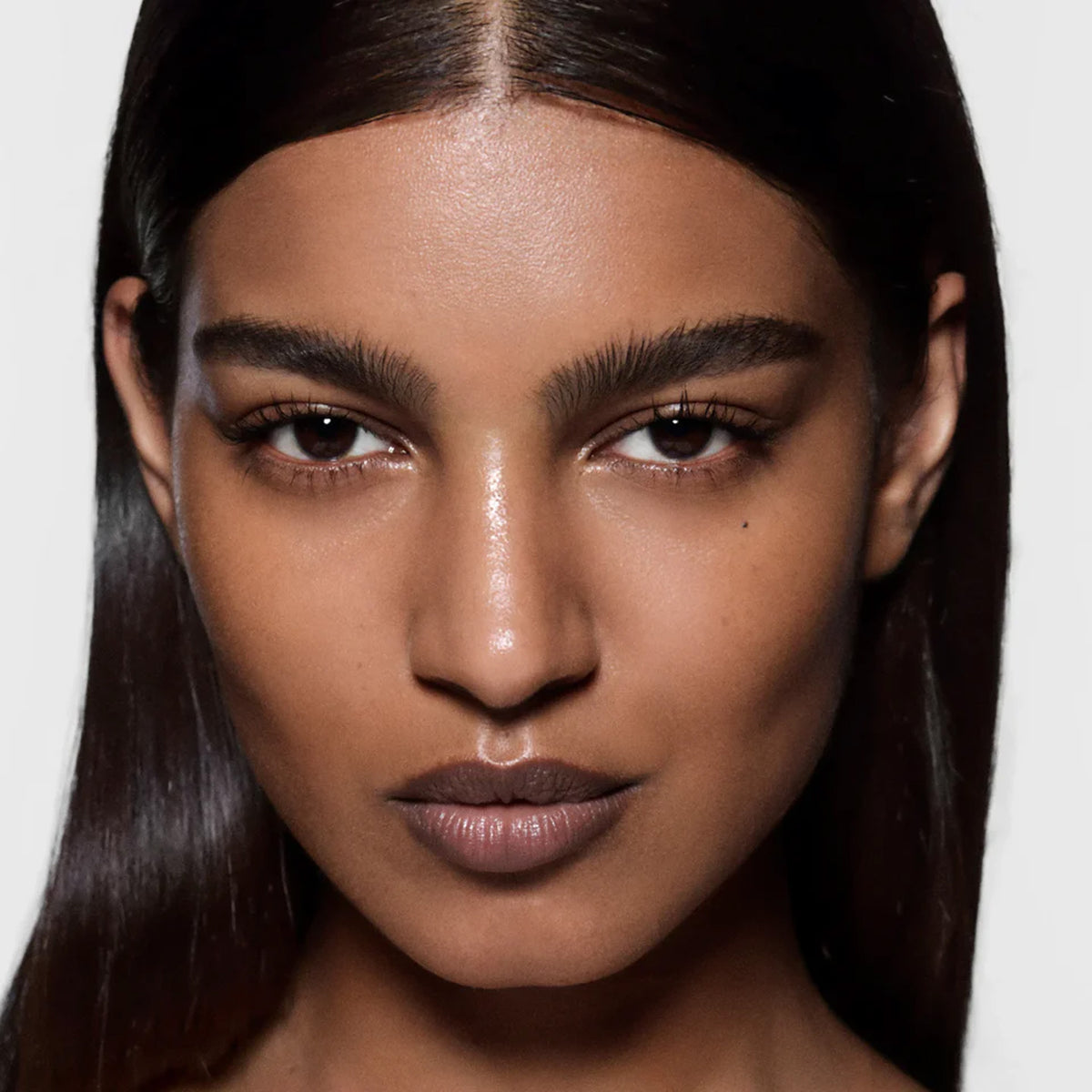 Close up of model's face wearing makeup