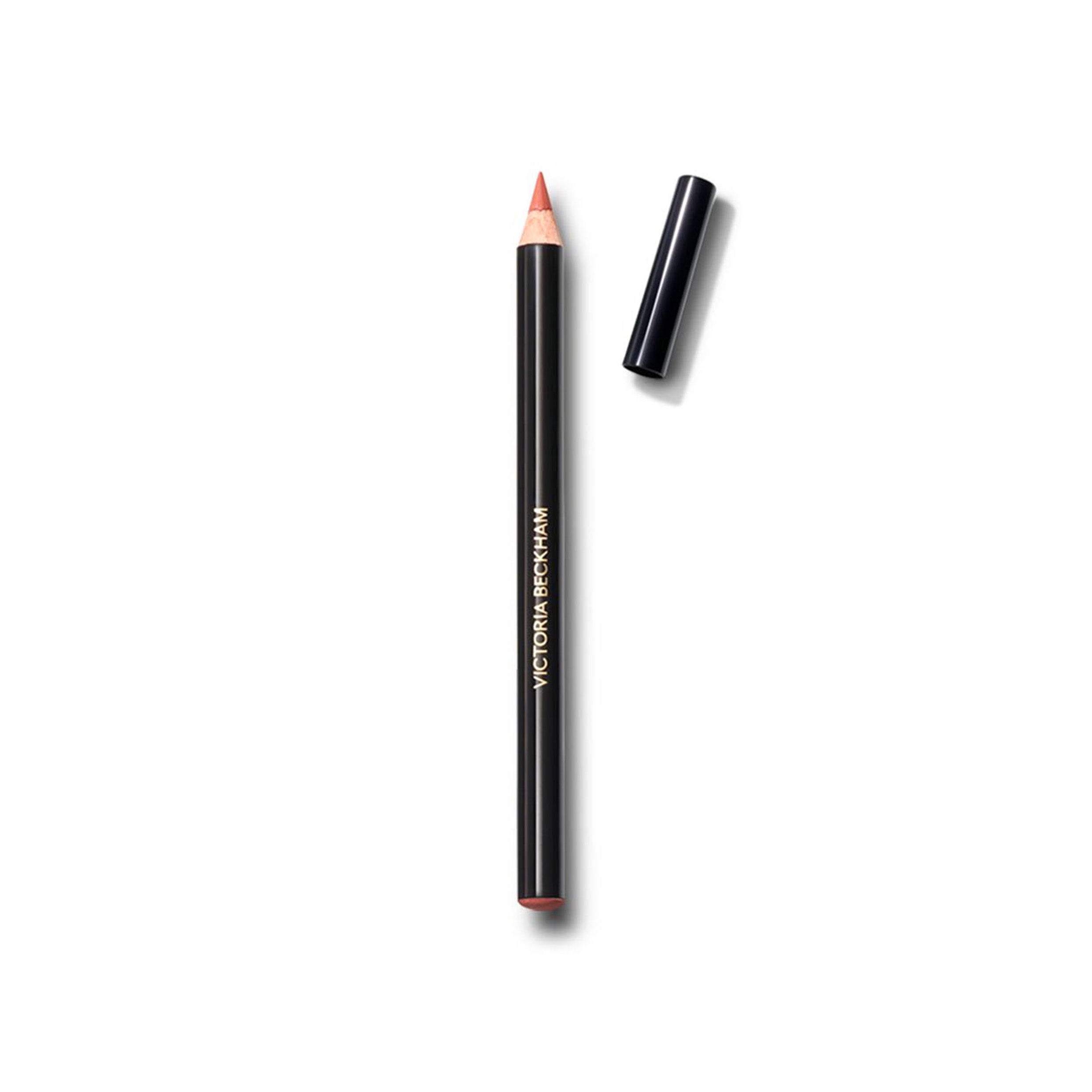 A pale peach colored lip definer pencil with its cap removed, displayed against a white background.