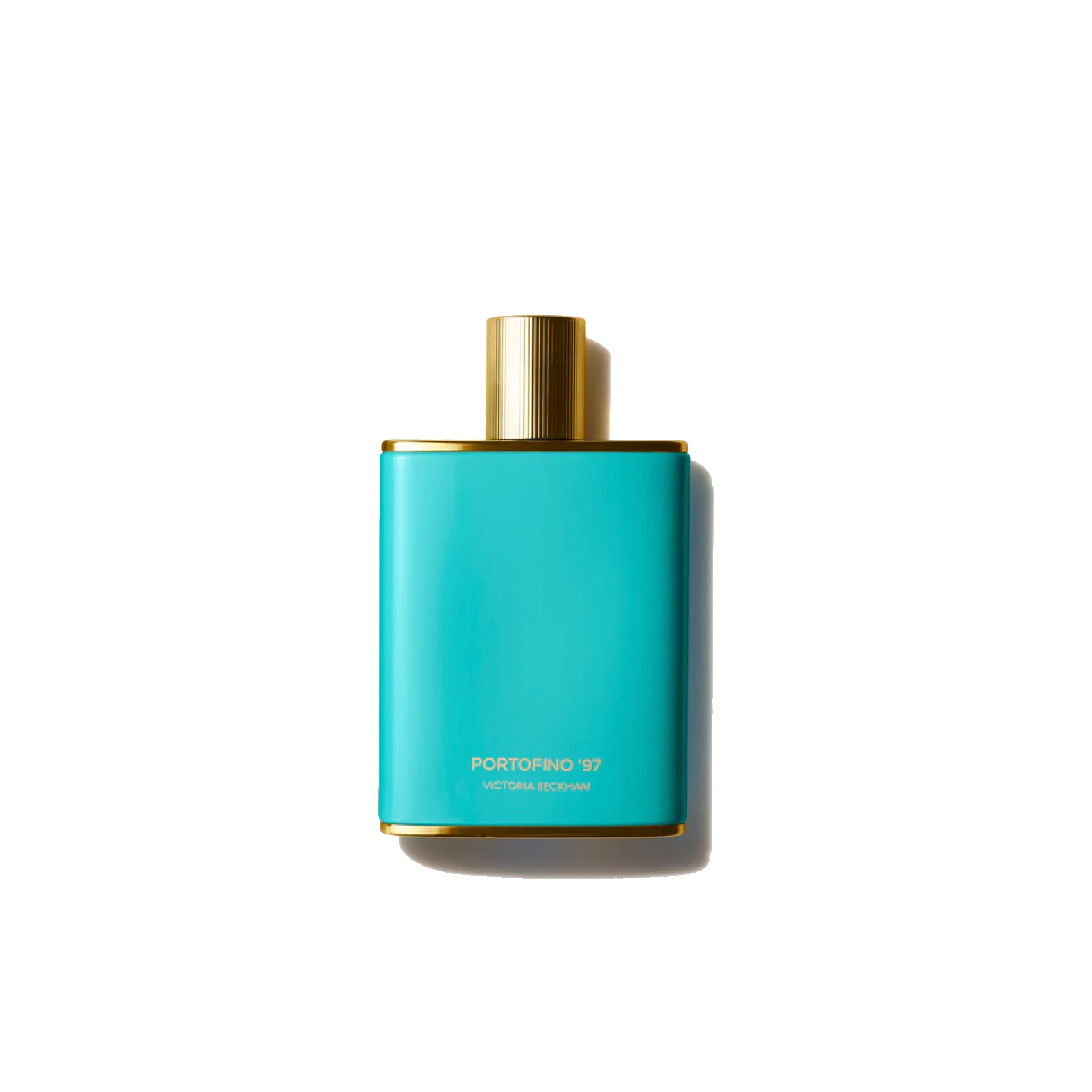 A blue perfume bottle with a gold cap labeled 'Victoria Beckham Beauty Portofino '97 Eau de Parfum'.