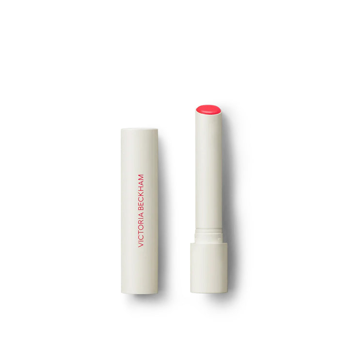 Victoria Beckham Beauty Posh Balm in Colette, a lip balm with a white bullet dispenser