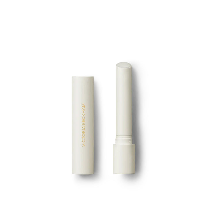 Victoria Beckham Beauty Posh Balm in Glace, a lip balm with a white bullet dispenser