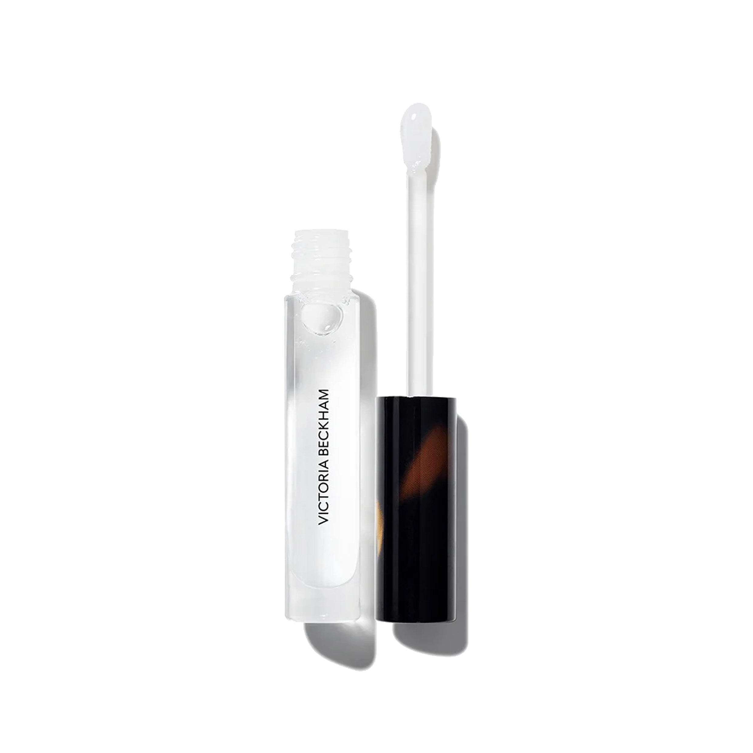 An open tube of Victoria Beckham Beauty Posh Gloss in Ice