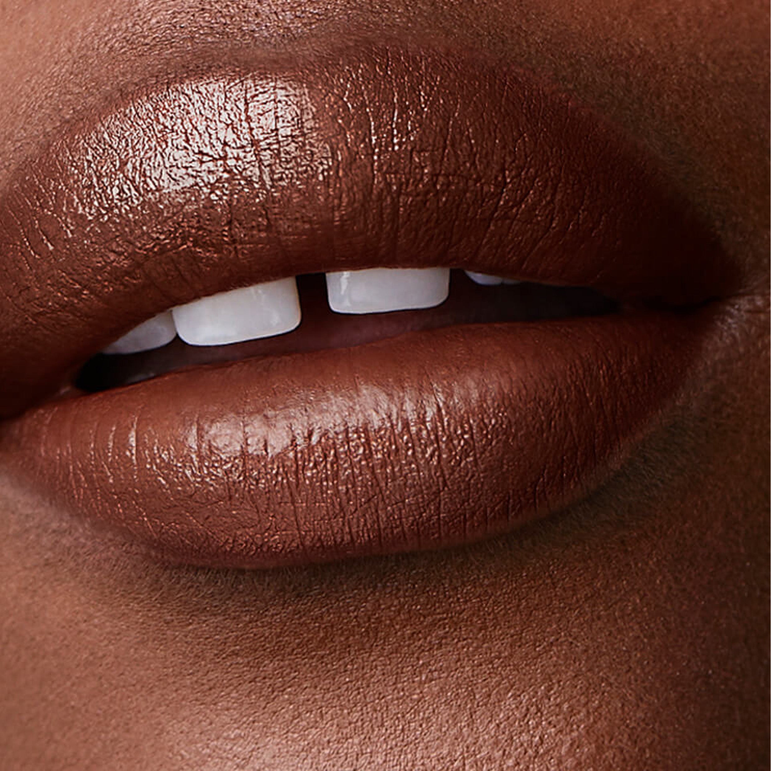 A close up image of lips wearing Victoria Beckham Beauty Posh Lipstick in Fringe