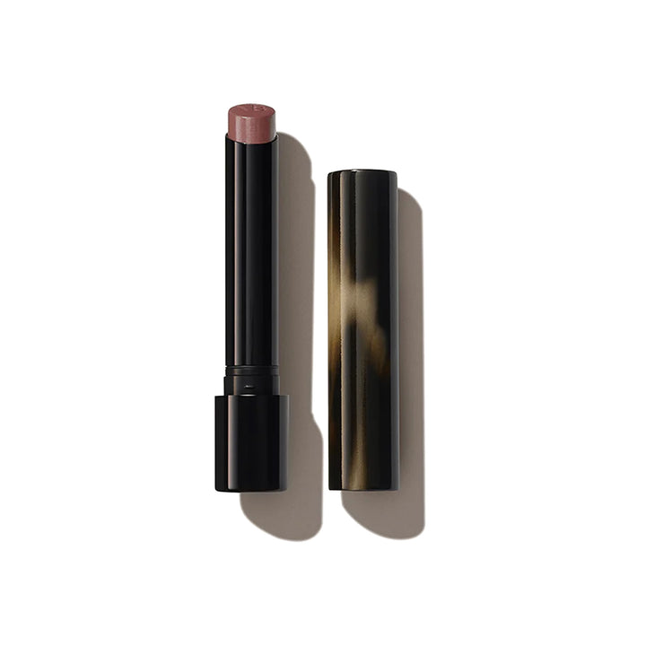 A Victoria Beckham Beauty Posh Lipstick in the shade 'Pose', with the cap removed, revealing a mid-tone mauve color.