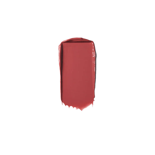 A lipstick swatch of a warm rose colour on a white background